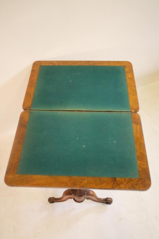 A VICTORIAN BURR WALNUT SEWING/CARD TABLE of rounded oblong form with inlaid floral sprays and Image