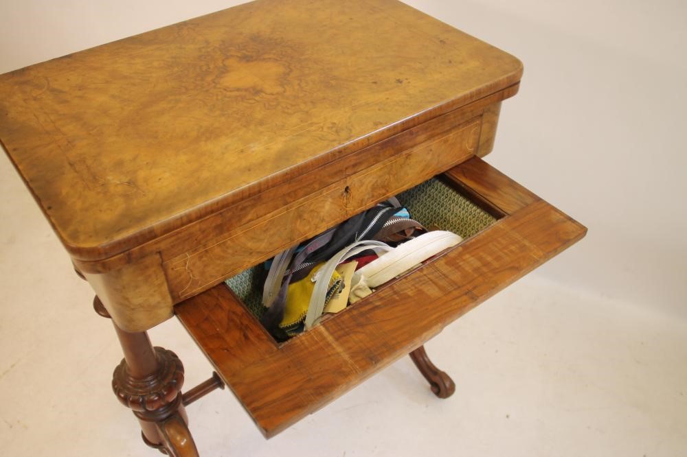 A VICTORIAN BURR WALNUT SEWING/CARD TABLE of rounded oblong form with inlaid floral sprays and Image