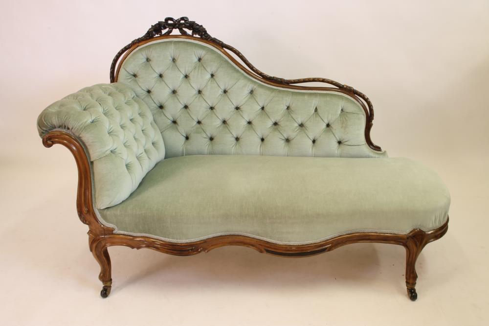 A VICTORIAN WALNUT CHAISE LONGUE of serpentine outline button upholstered in pale green dralon Image