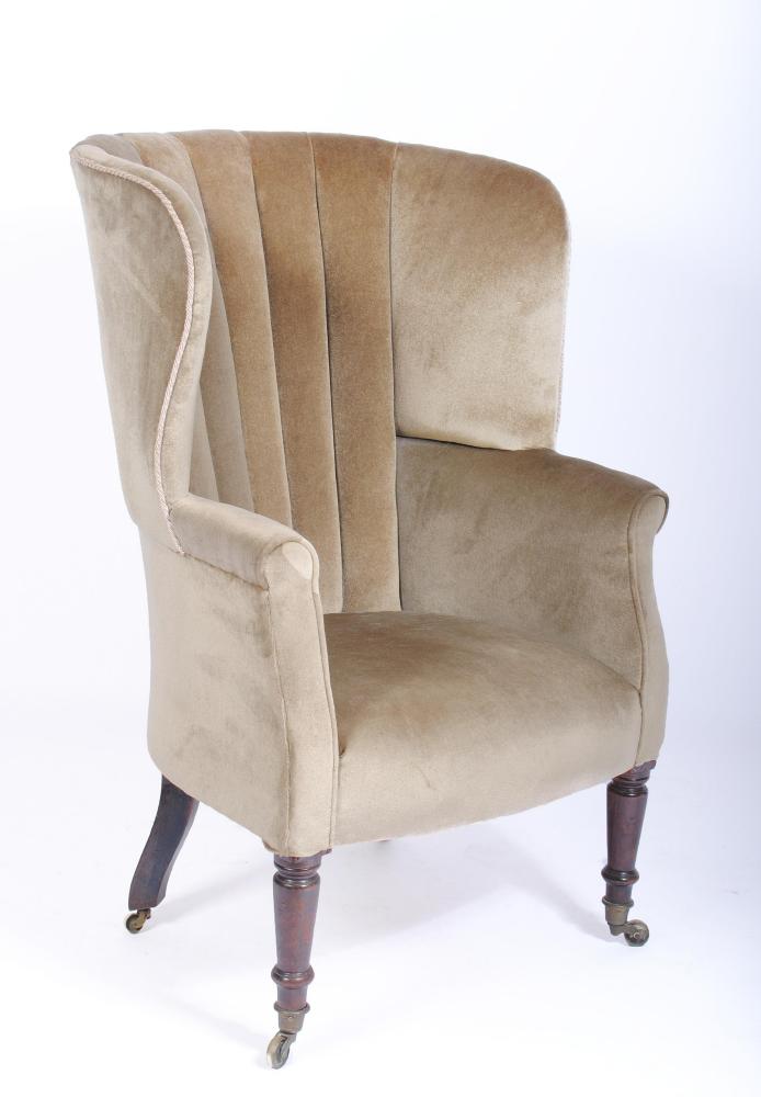 A GEORGE III BARREL BACK WING ARMCHAIR Image