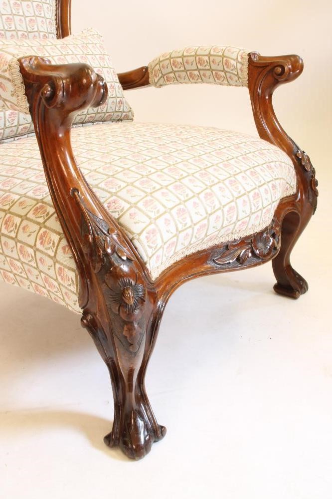 A VICTORIAN WALNUT ARMCHAIR of spoonback form upholstered in a modern pale green floral weave Image