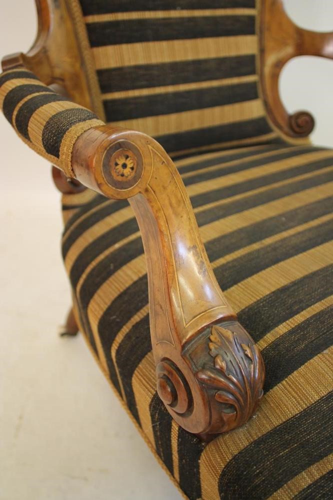 A VICTORIAN WALNUT ARMCHAIR of spoonback form with stringing and marquetry paterae Image