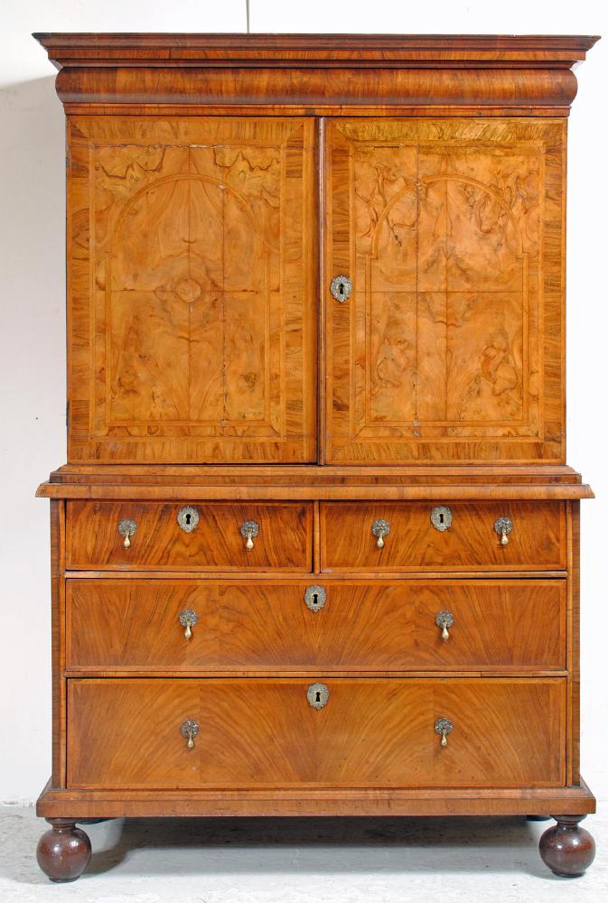 AN EARLY GEORGIAN AND LATER WALNUT AND FEATHER BANDED CABINET ON CHEST Image