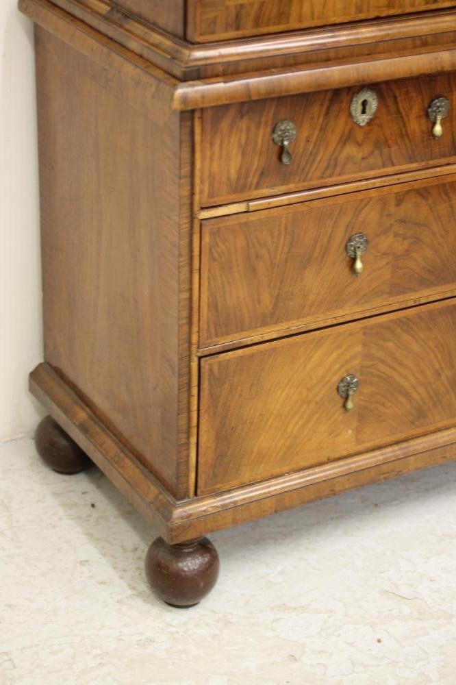 AN EARLY GEORGIAN AND LATER WALNUT AND FEATHER BANDED CABINET ON CHEST Image