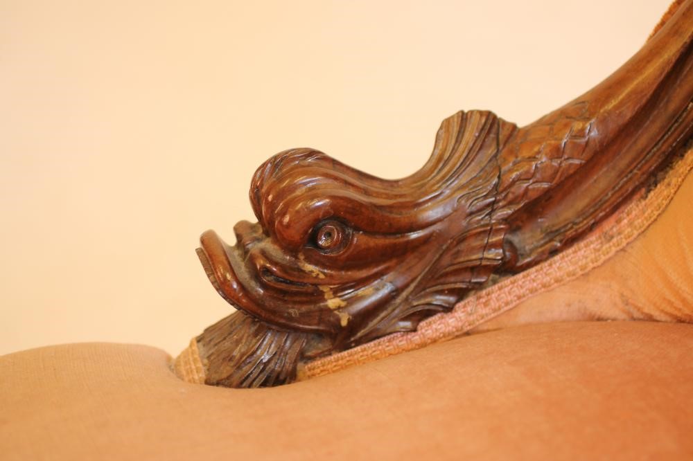 A VICTORIAN WALNUT FRAMED NURSING CHAIR of spoon back form upholstered in a pink velvet Image