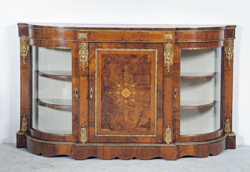 A VICTORIAN WALNUT AND AMBOYNA CREDENZA of breakfront D form with gilt metal mounts Image