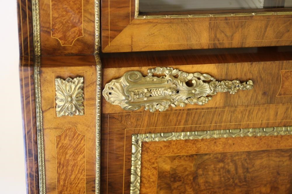 A VICTORIAN WALNUT AND AMBOYNA CREDENZA of breakfront D form with gilt metal mounts Image