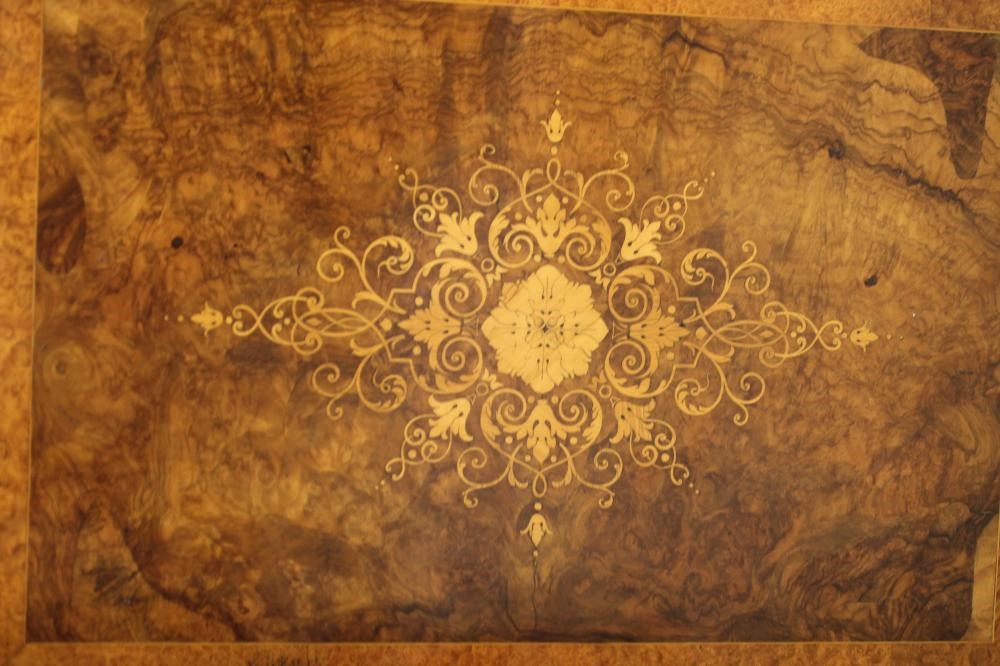 A VICTORIAN WALNUT AND AMBOYNA CREDENZA of breakfront D form with gilt metal mounts Image