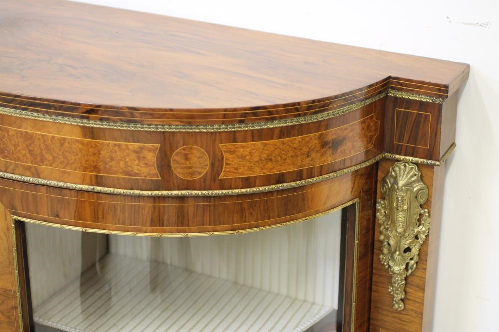 A VICTORIAN WALNUT AND AMBOYNA CREDENZA of breakfront D form with gilt metal mounts Image