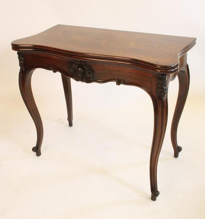 A VICTORIAN ROSEWOOD CARD TABLE of oblong serpentine form Image