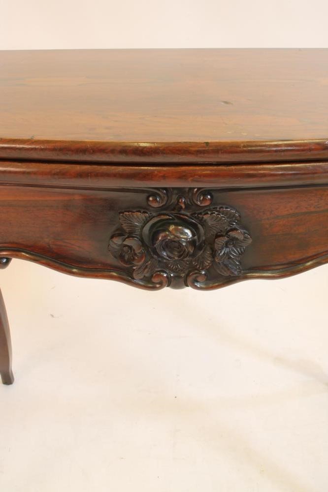 A VICTORIAN ROSEWOOD CARD TABLE of oblong serpentine form Image