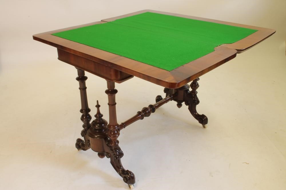 A VICTORIAN MAHOGANY CARD TABLE of oblong pillar end form Image