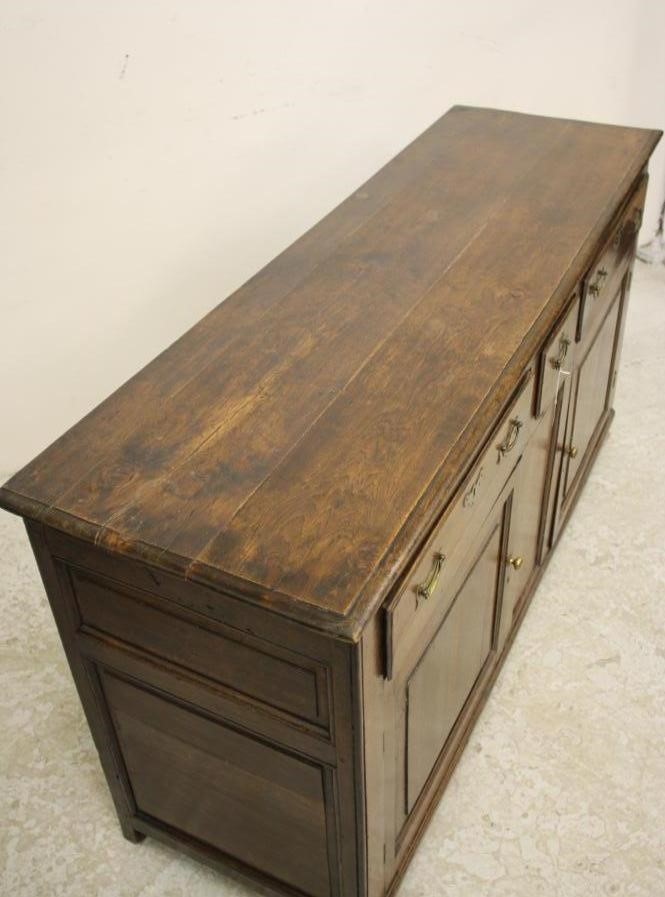 A GEORGIAN OAK ENCLOSED DRESSER Image