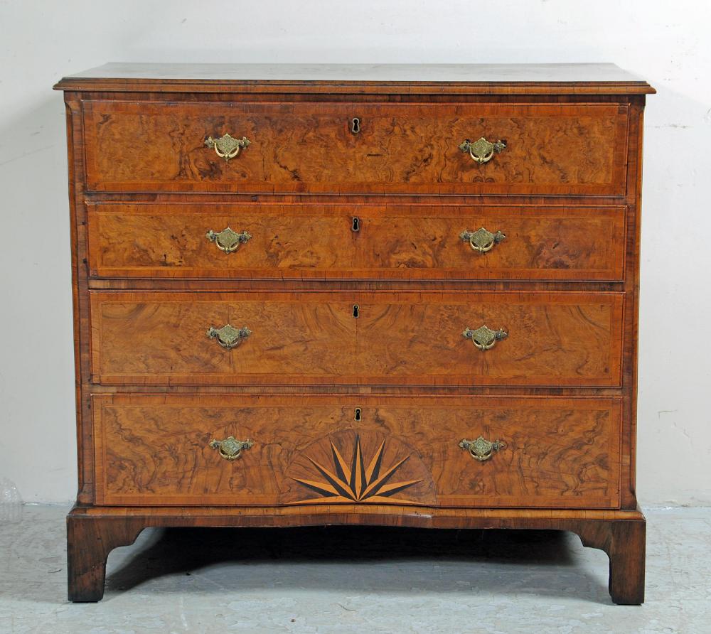 A GEORGIAN WALNUT AND FEATHER BANDED SECRETAIRE CHEST Image
