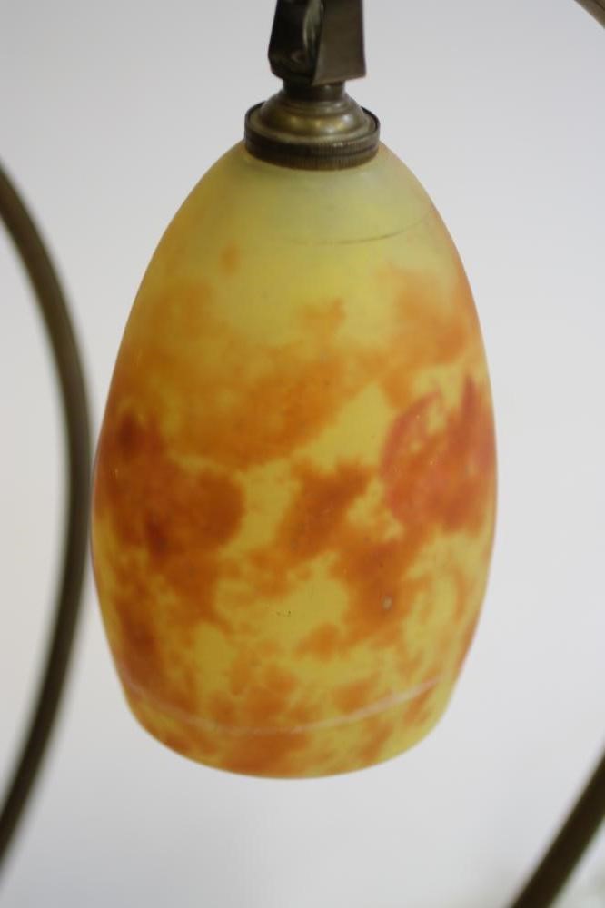 A COMPOSITE PAIR OF ART NOUVEAU MARJORELLE STYLE BRASS LAMPS Image