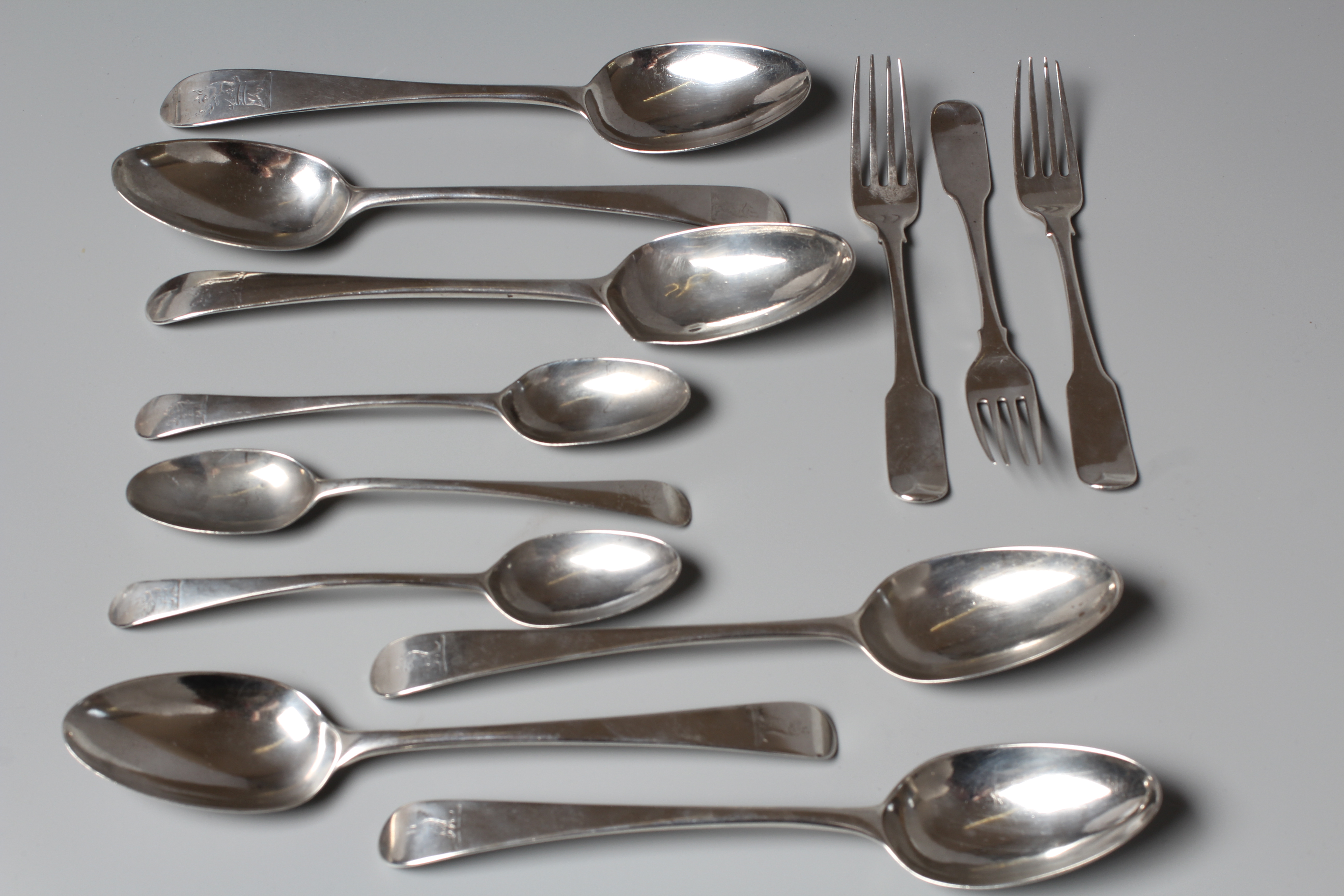 A COLLECTION OF IRISH FLATWARE comprising a set of three each dessert forks and spoons by Tudor & Image