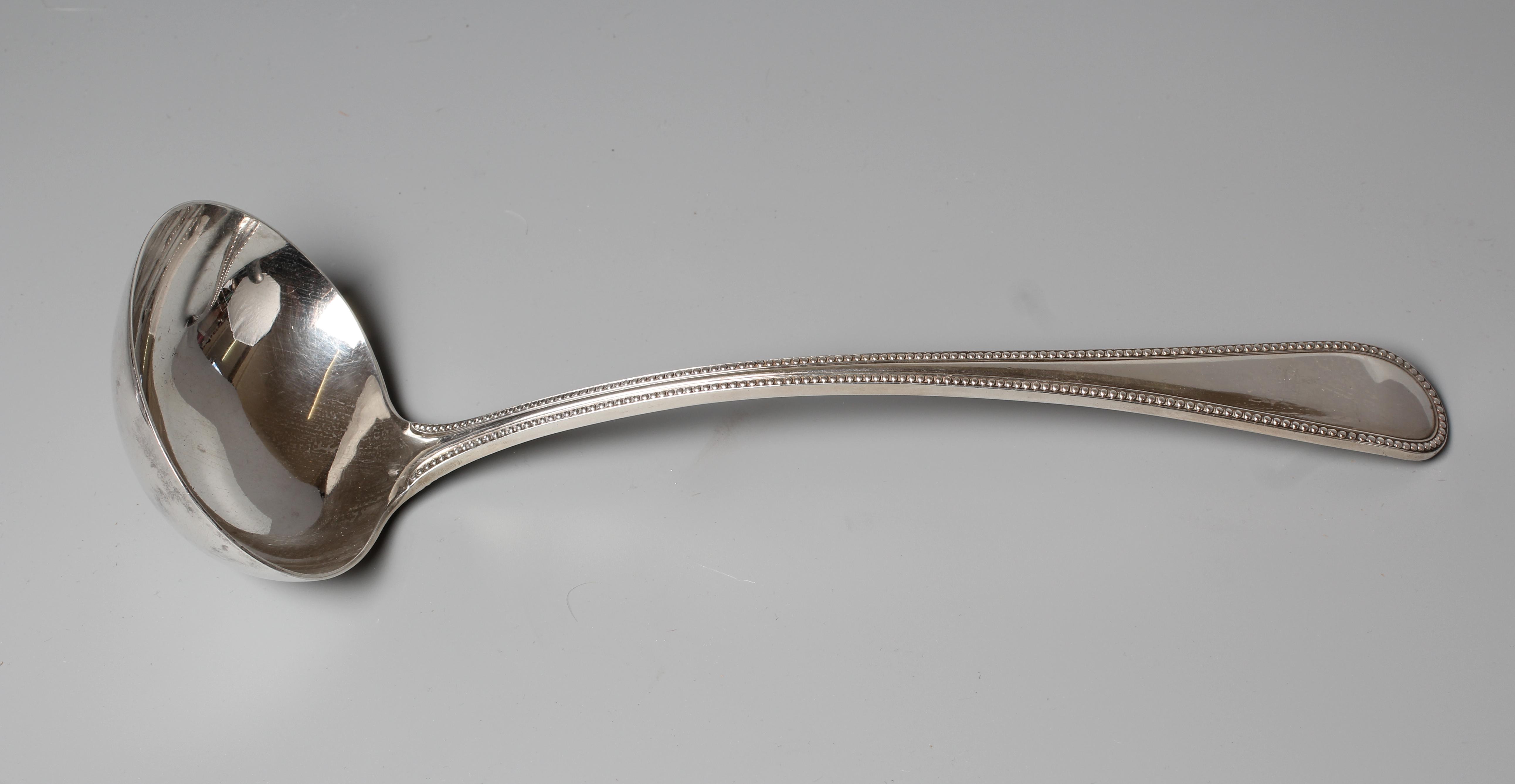 AN EDWARD VII BEAD PATTERN SOUP LADLE by Reid & Sons, London 1906, 12" long, 9ozs 15dwts Image