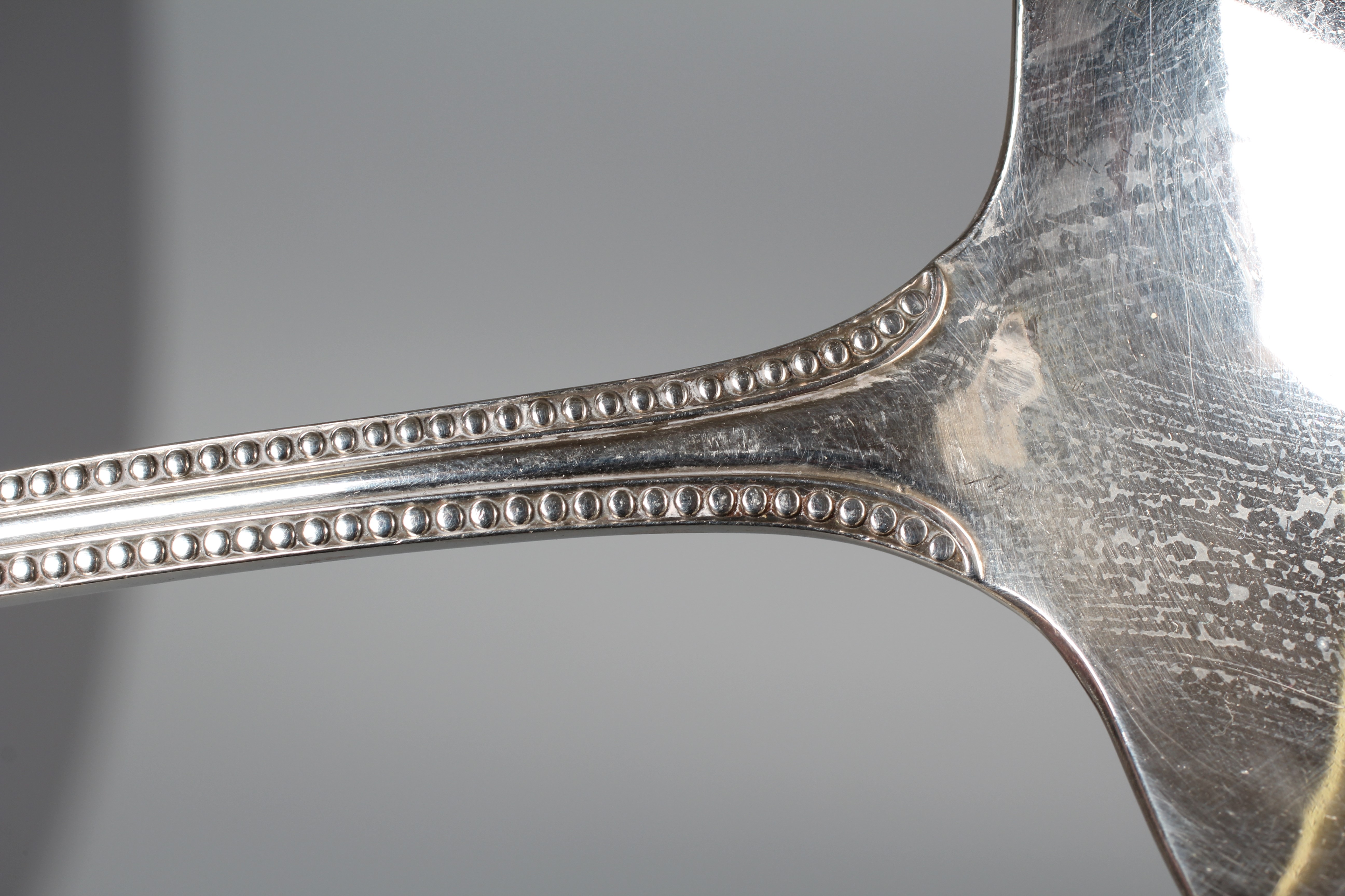 AN EDWARD VII BEAD PATTERN SOUP LADLE by Reid & Sons, London 1906, 12" long, 9ozs 15dwts Image