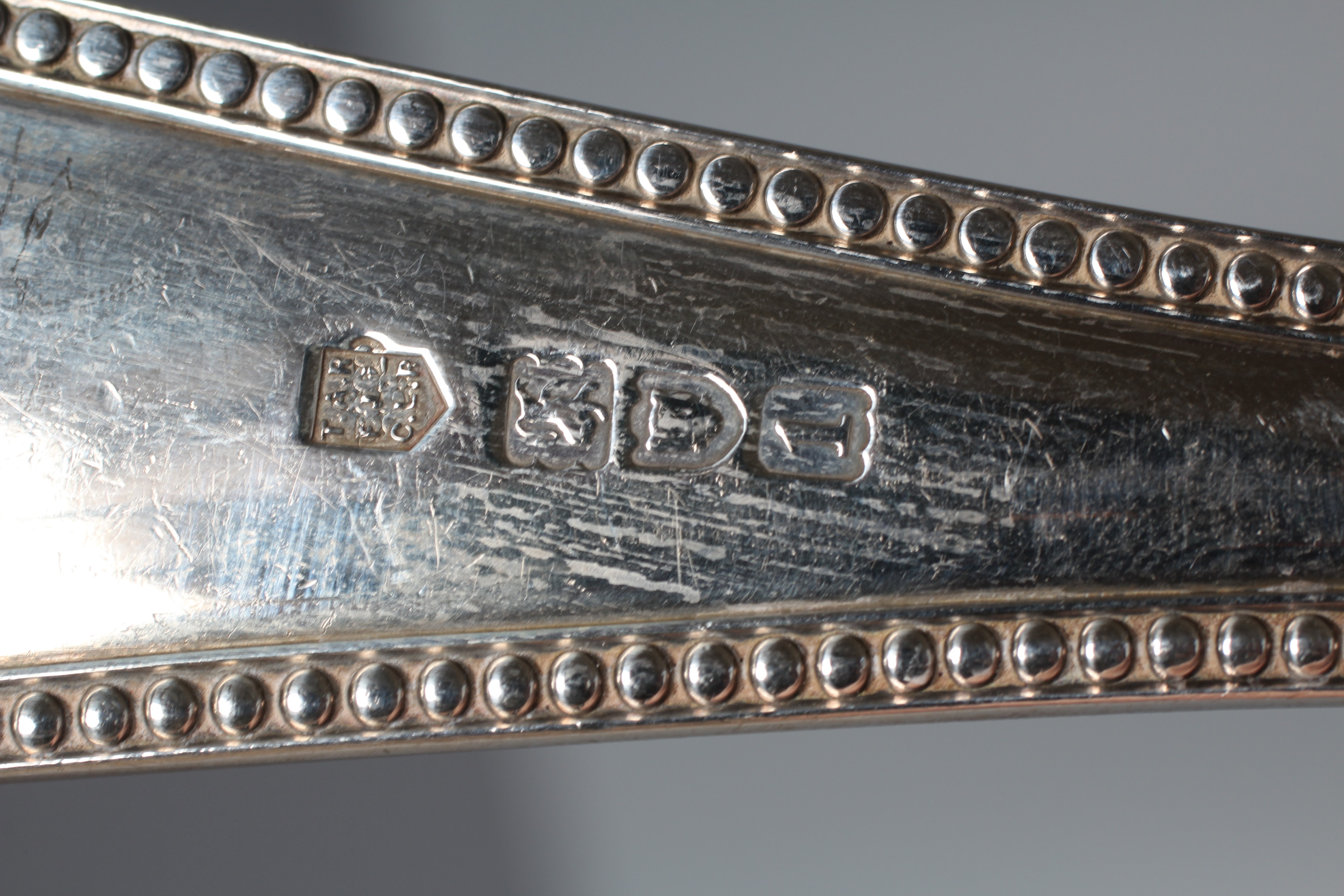 AN EDWARD VII BEAD PATTERN SOUP LADLE by Reid & Sons, London 1906, 12" long, 9ozs 15dwts Image