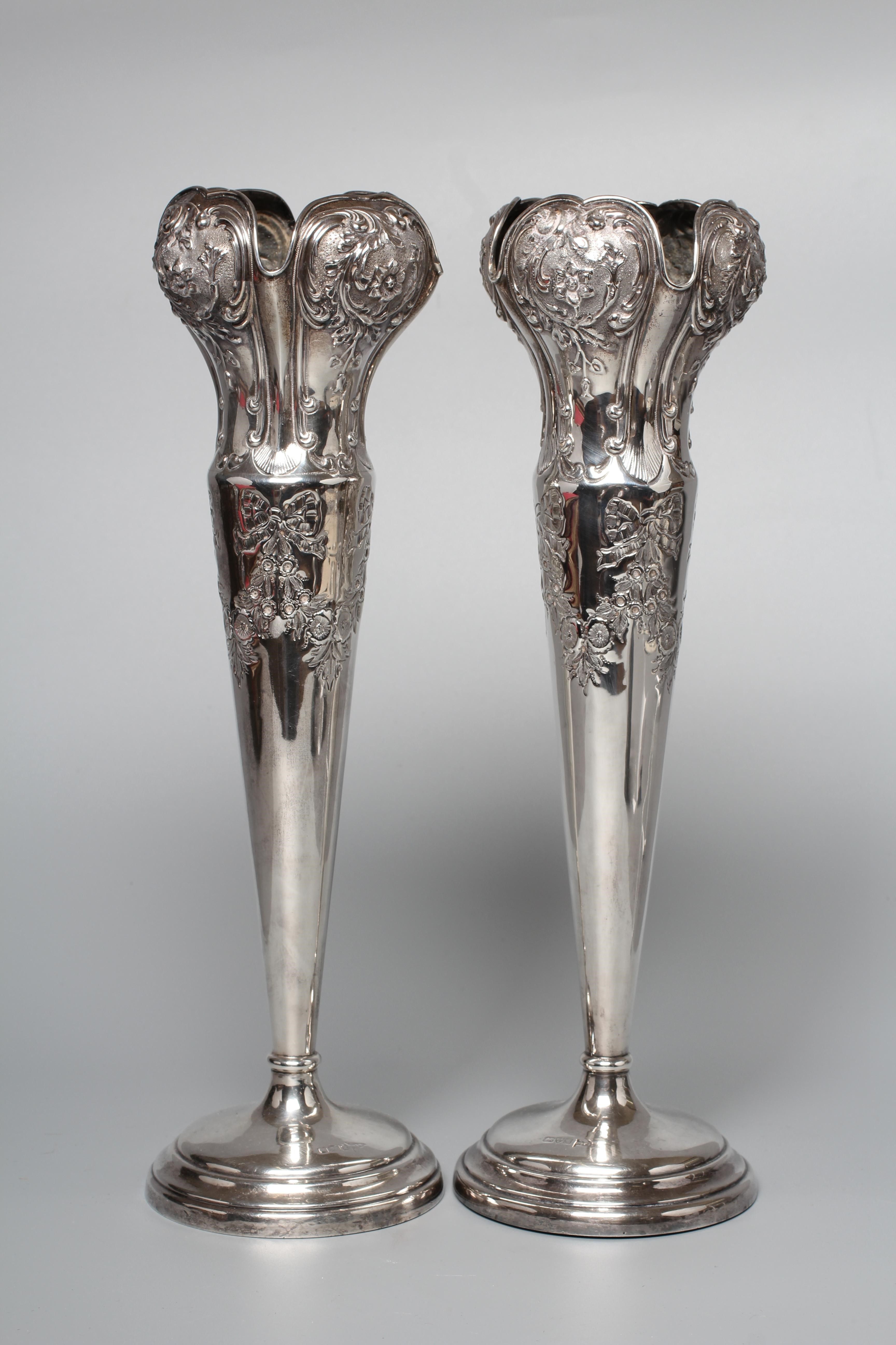 A PAIR OF EDWARD VII TALL VASES by Walker & Hall Image