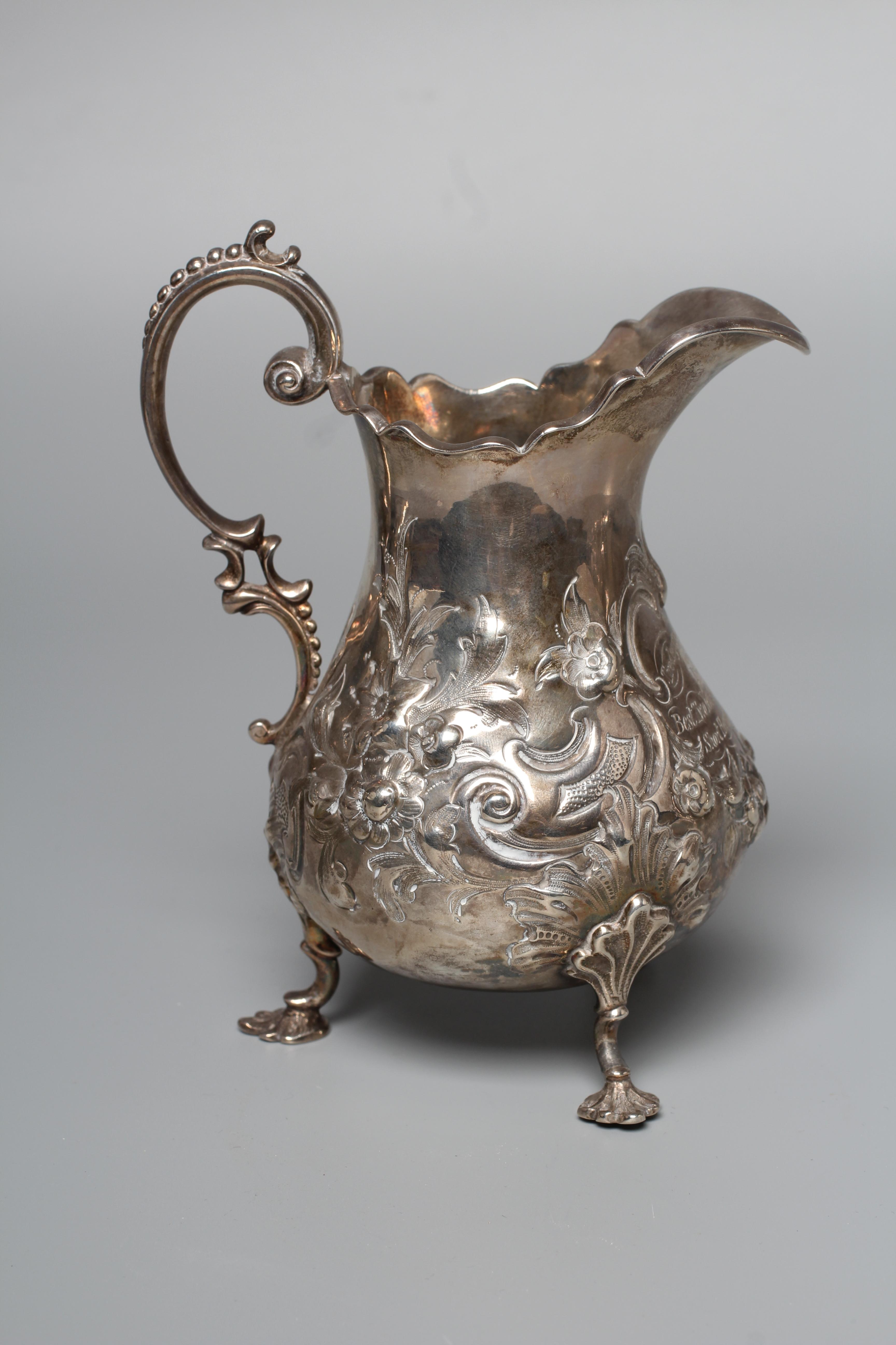 A VICTORIAN MILK JUG probably by Robert Harper Image