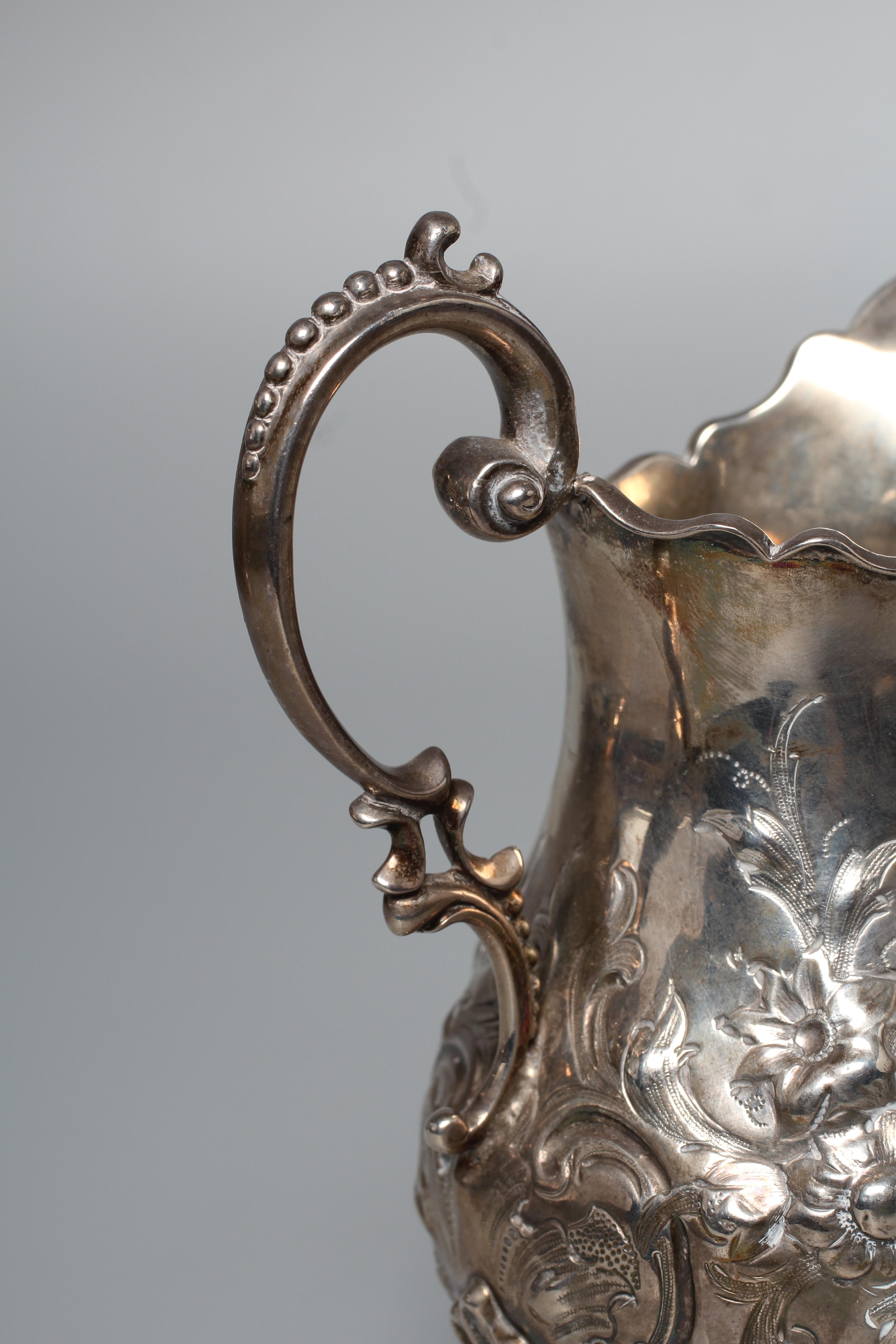 A VICTORIAN MILK JUG probably by Robert Harper Image