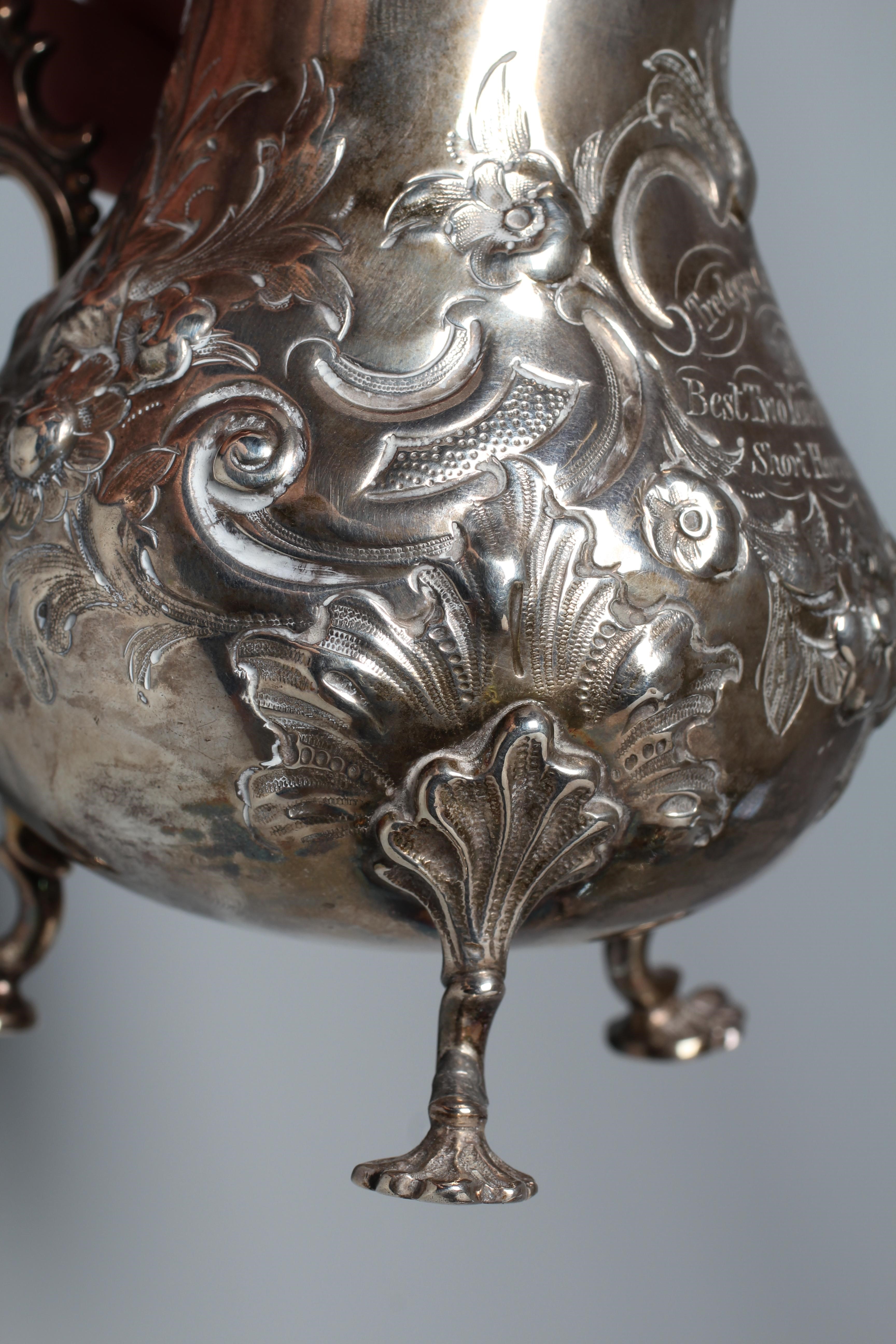 A VICTORIAN MILK JUG probably by Robert Harper Image