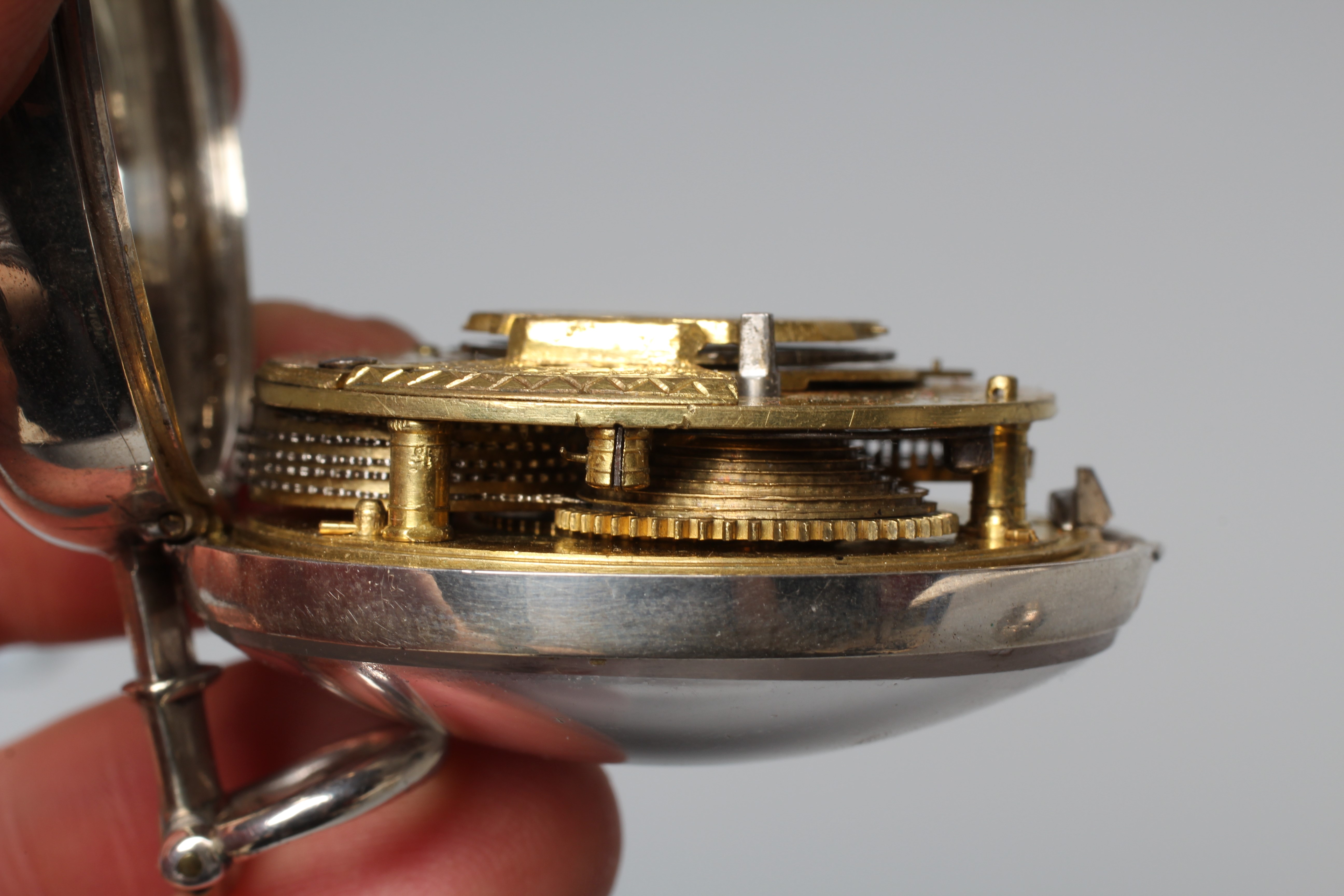 A SILVER PAIR CASED ASTROLOGICAL POCKET WATCH Image