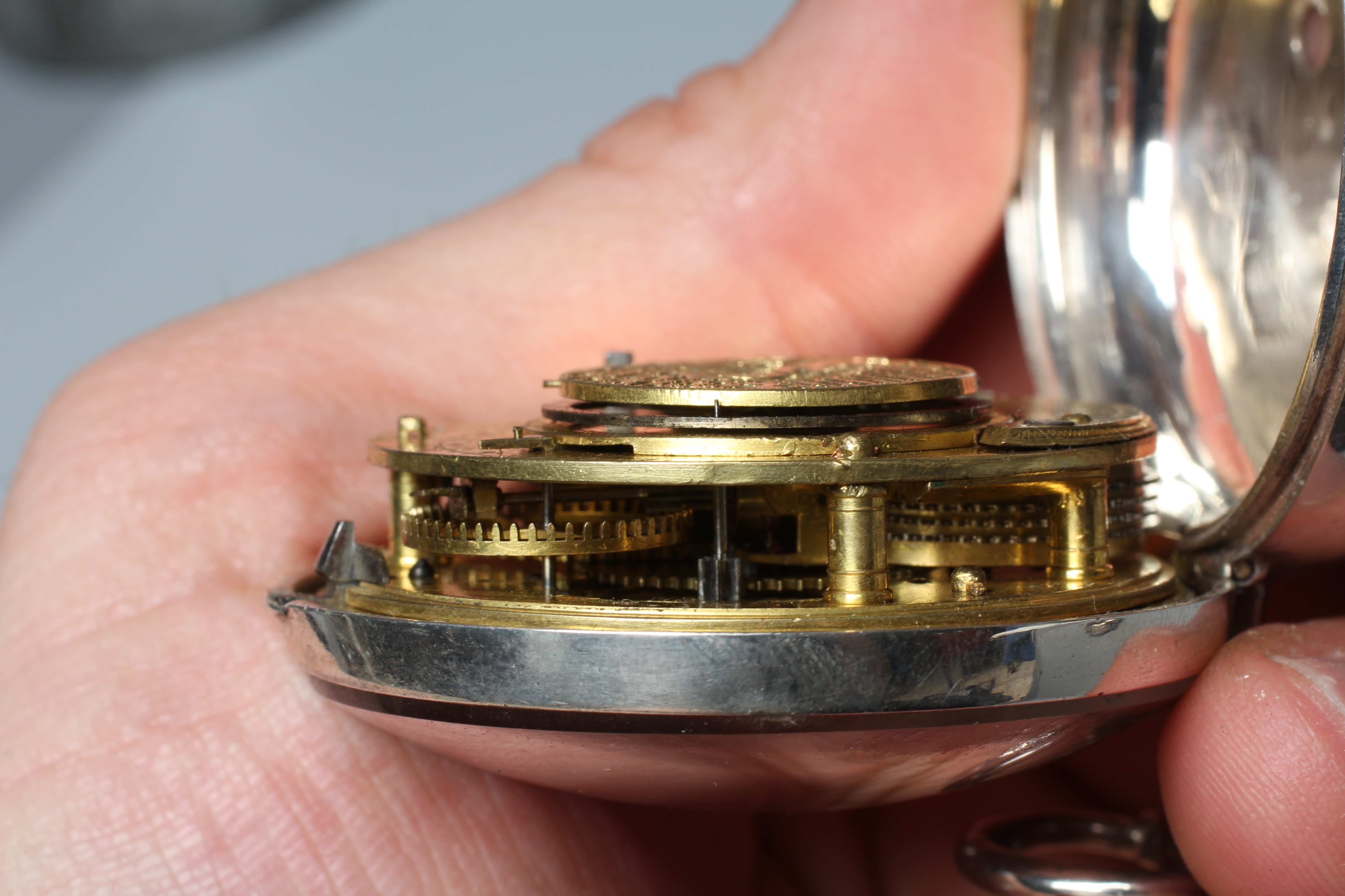 A SILVER PAIR CASED ASTROLOGICAL POCKET WATCH Image