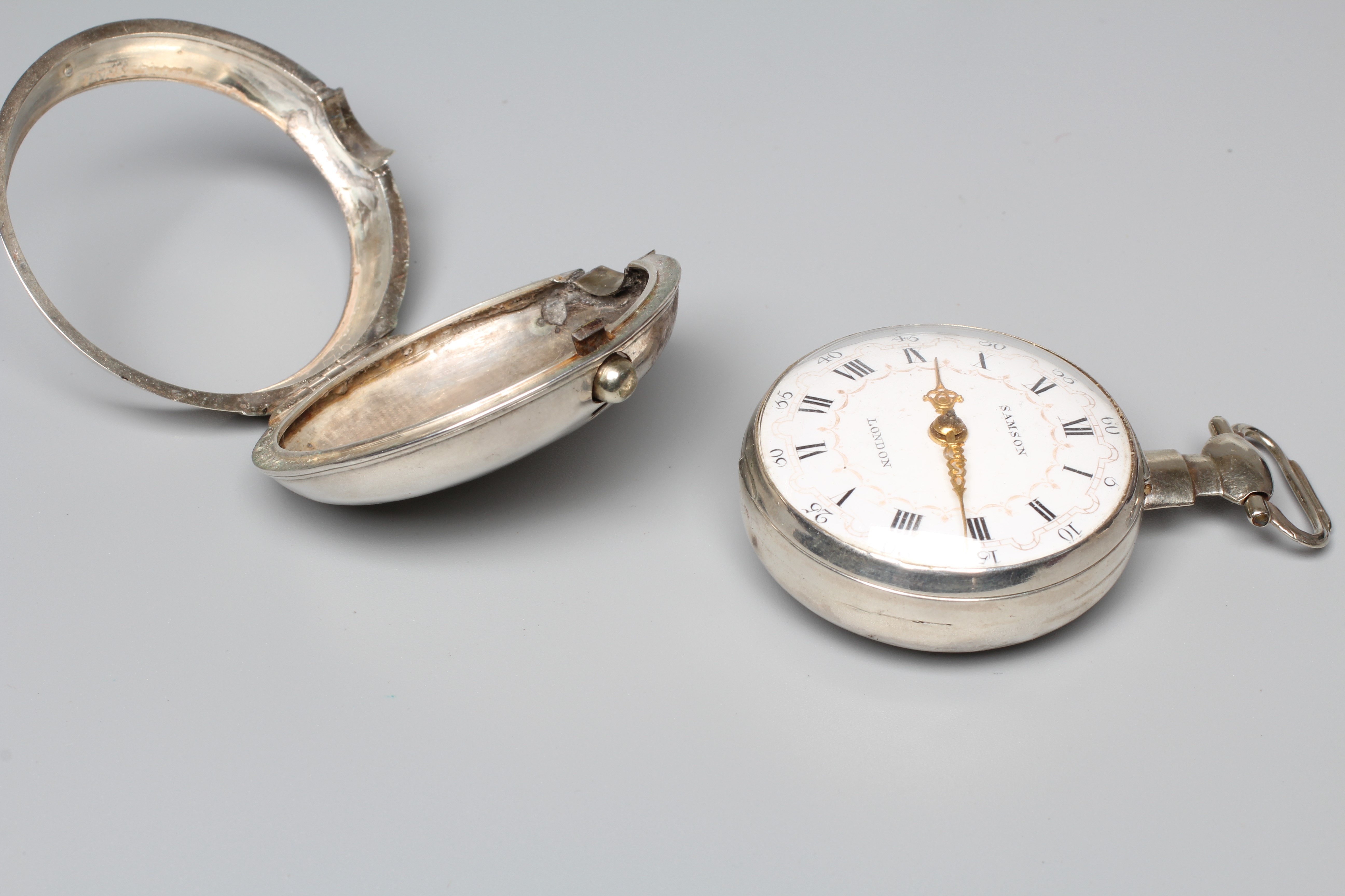 A LATE GEORGE III SILVER PAIR CASED POCKET WATCH Image
