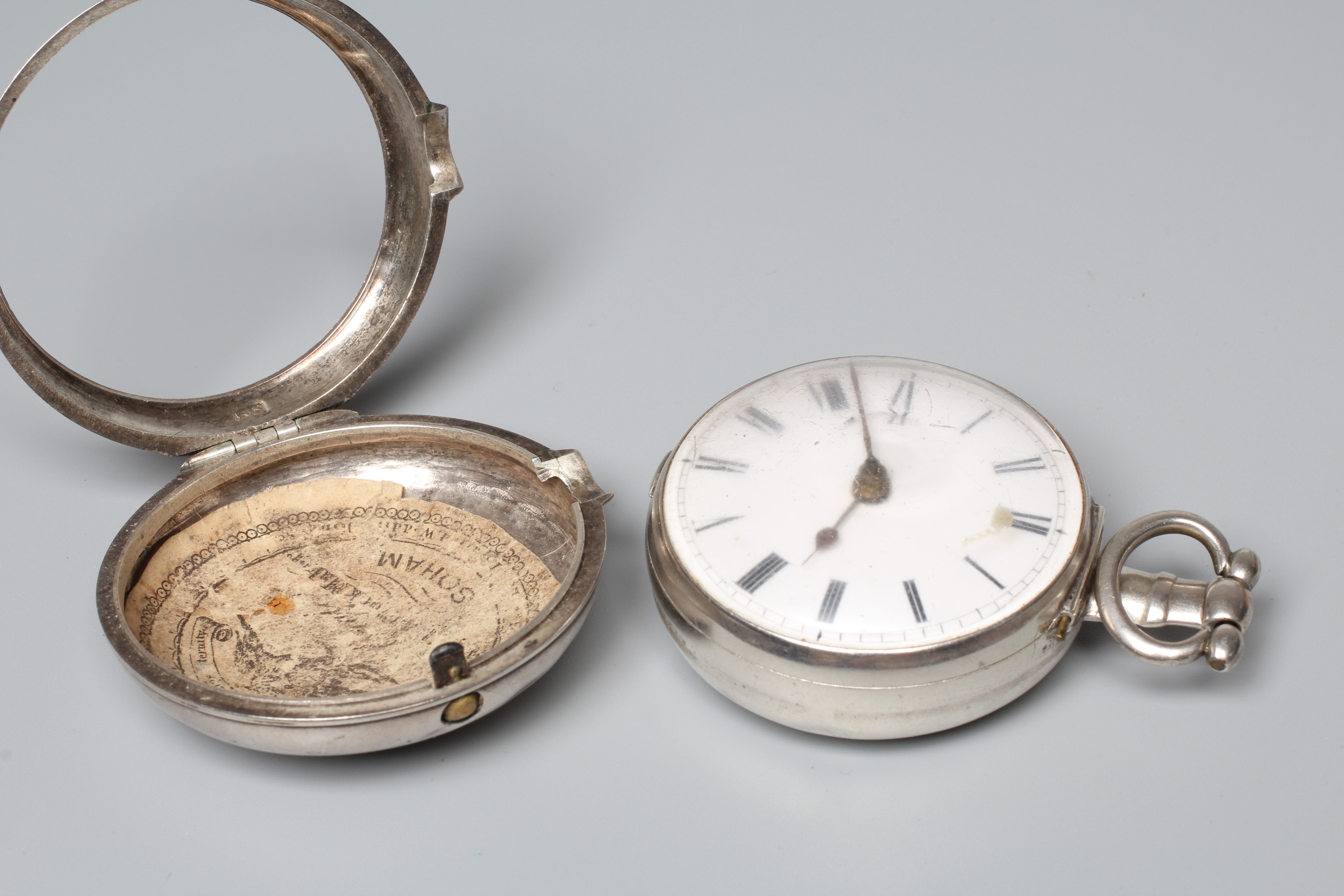A SILVER PAIR CASED POCKET WATCH, the white dial with black Roman numerals, the verge movement with Image