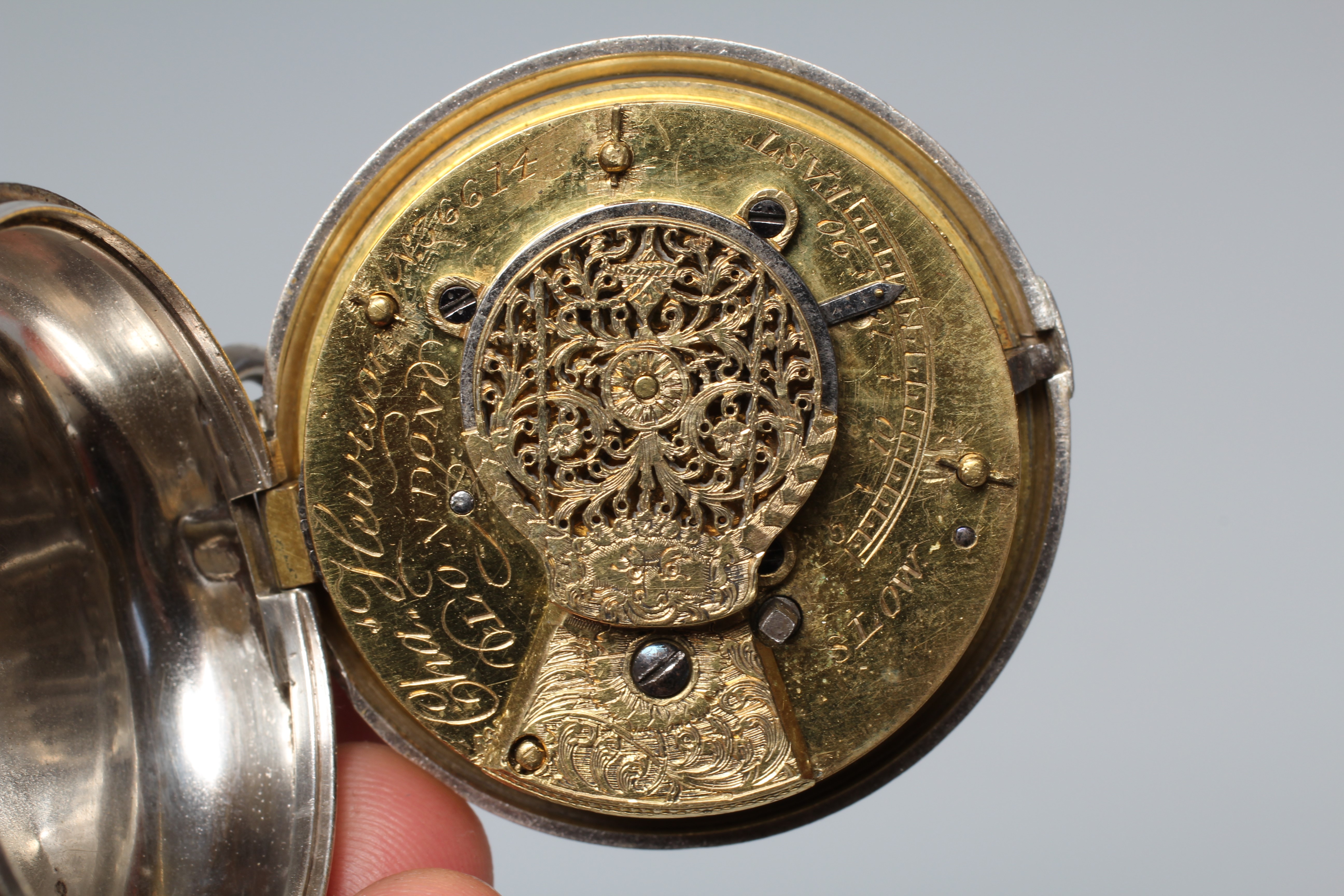 A SILVER PAIR CASED POCKET WATCH, the white dial with black Roman numerals, the verge movement with Image