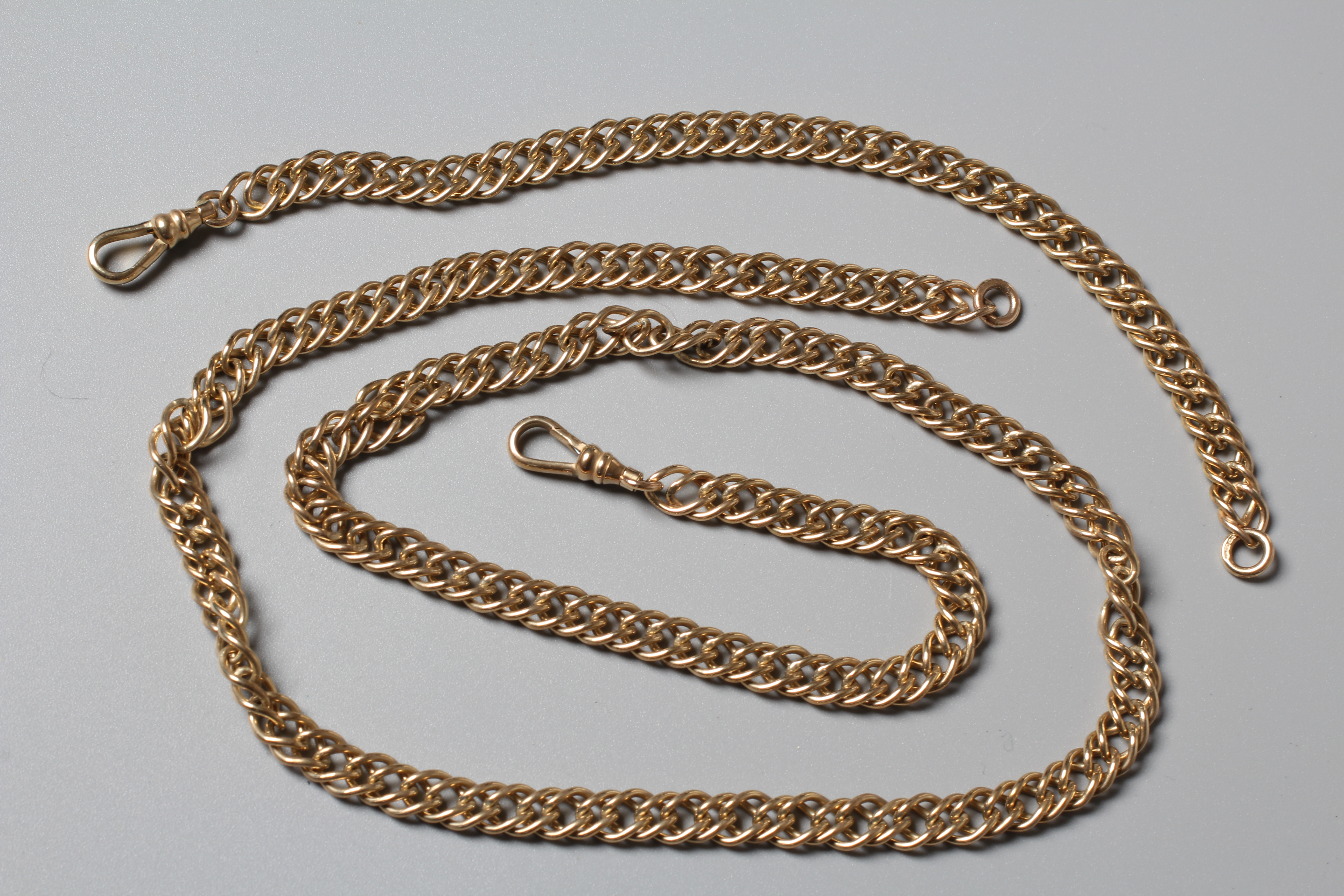 A DOUBLE CURB LINK ALBERT CHAIN with dog-clip fastener stamped 9ct and ring stamped 375, 24" long, Image