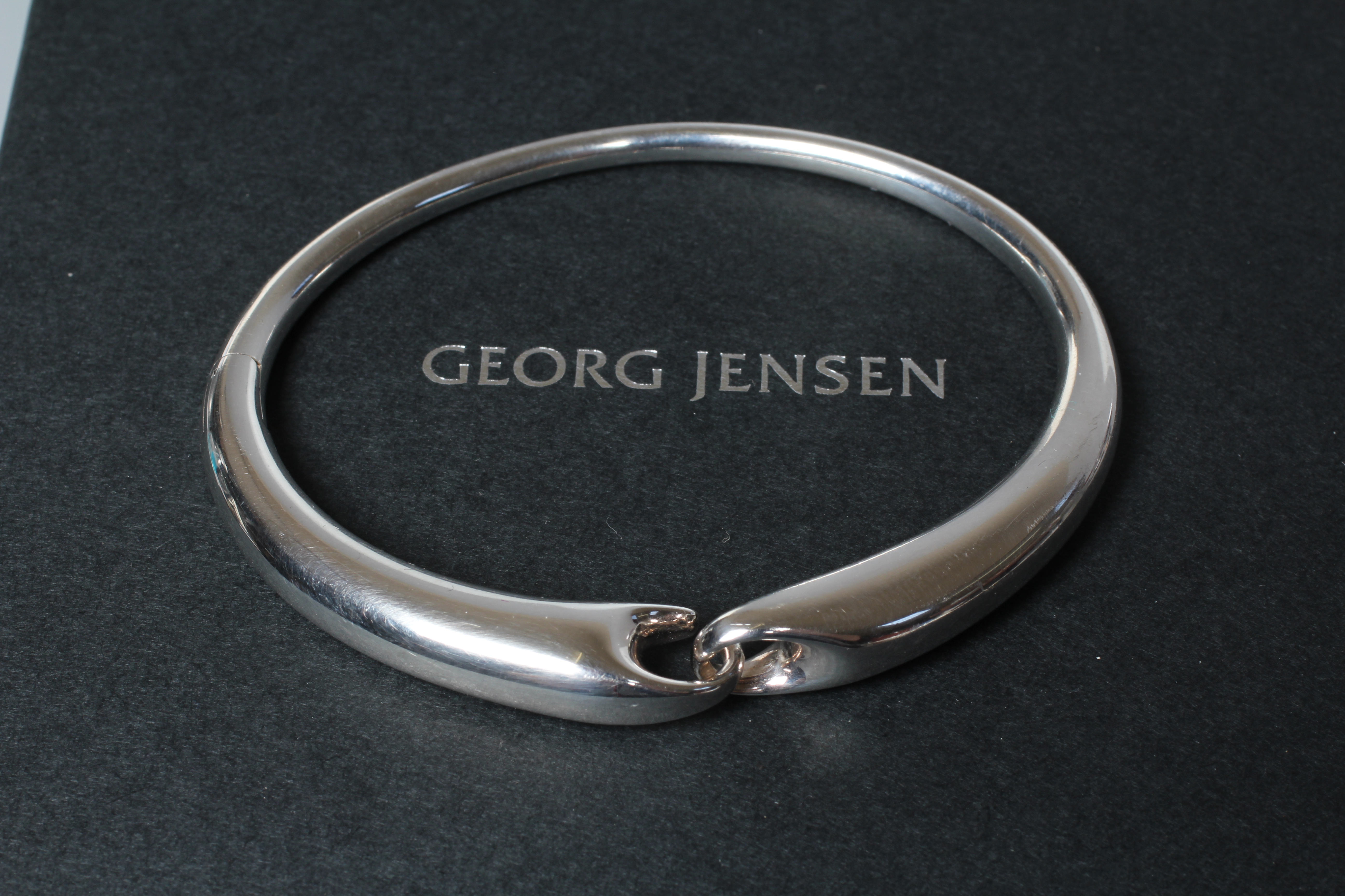 A GEORG JENSEN SILVER REFLECT BANGLE designed by Jacqueline Rabun, stamped 925S, 652, cased and Image