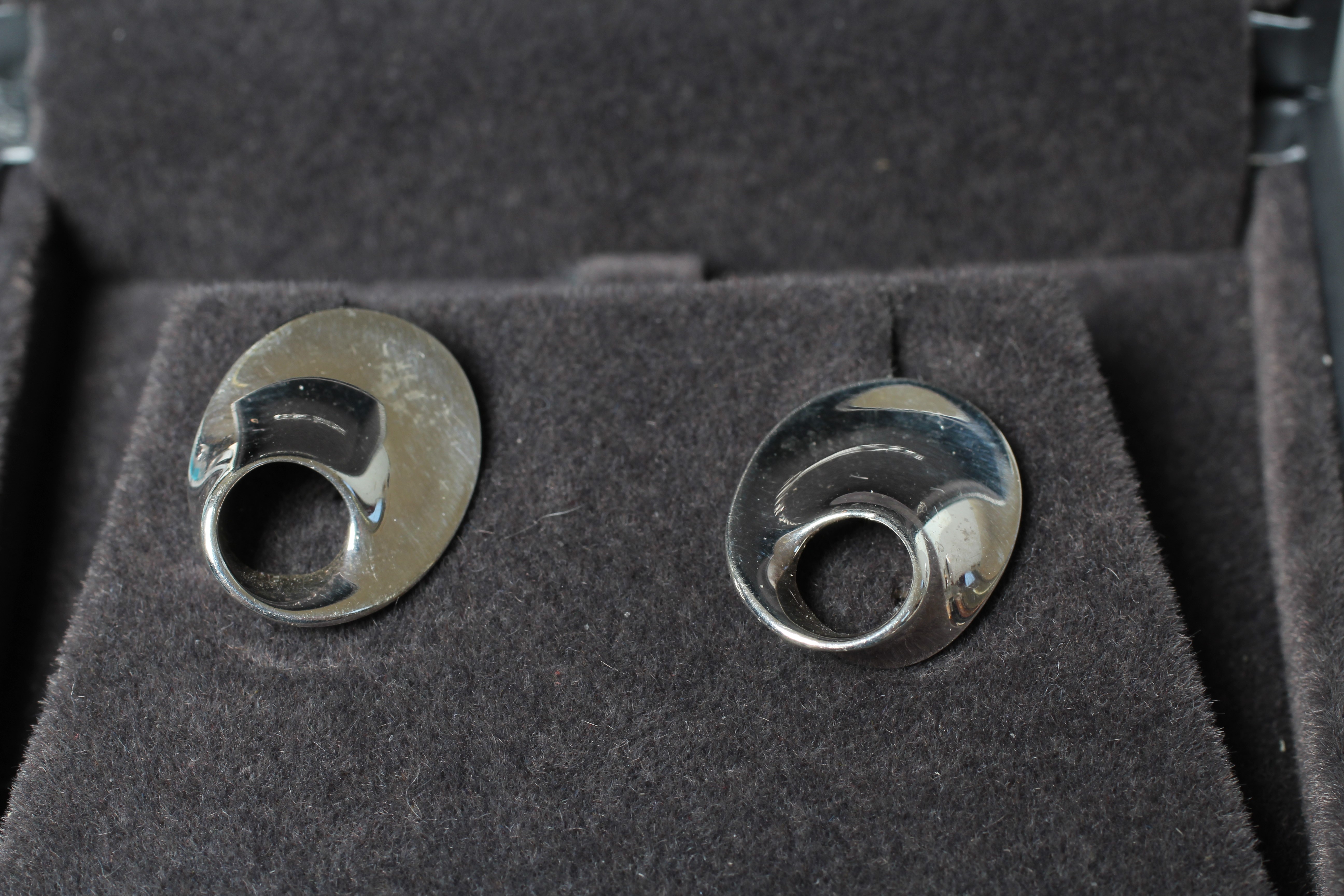 A PAIR OF GEORG JENSEN SILVER EAR STUDS designed by Vivianna Torun and realistically modelled as Image