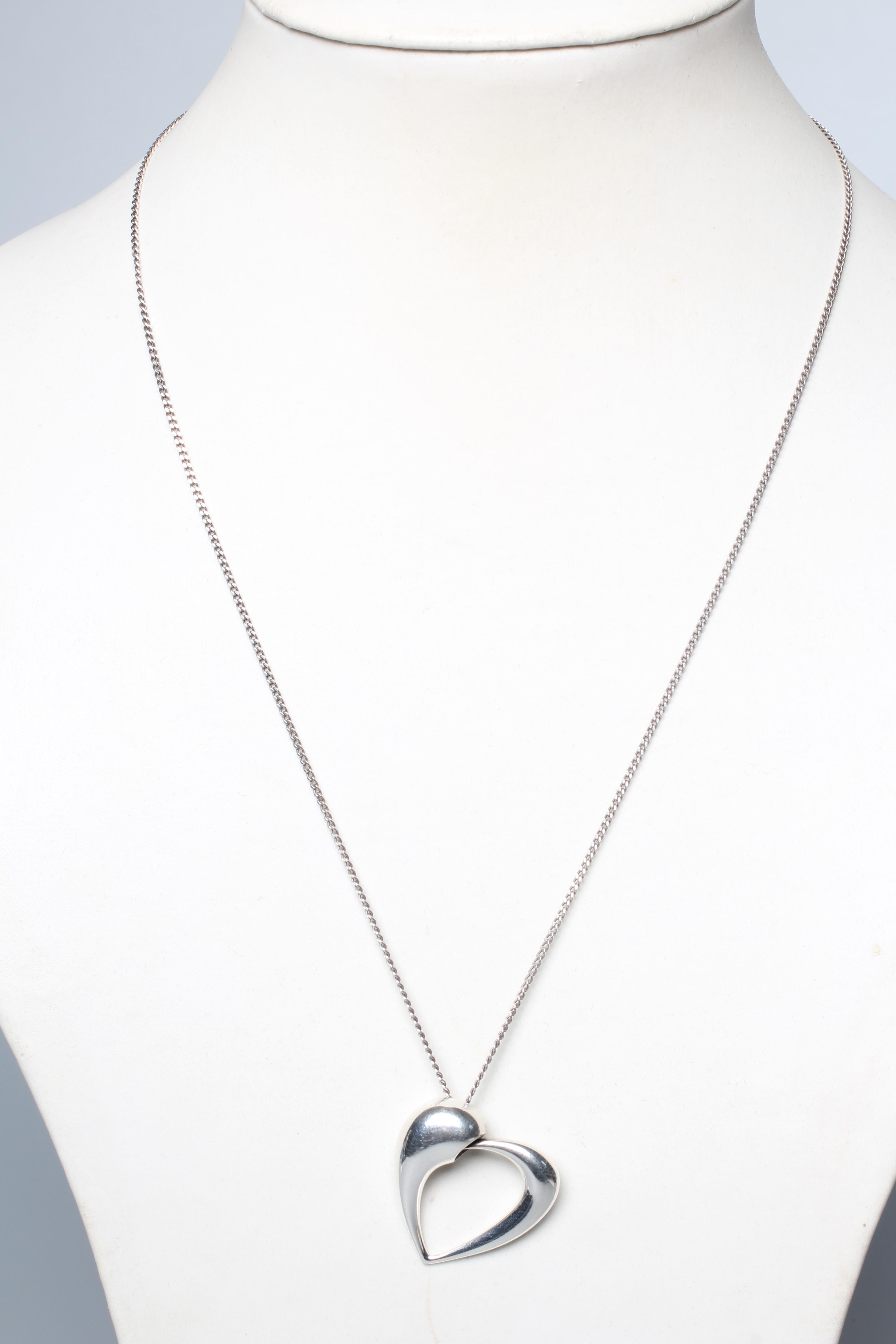 A GEORG JENSEN SILVER YEAR OF THE HEART PENDANT designed by Karim Rashid for Georg Jensen, on a Image