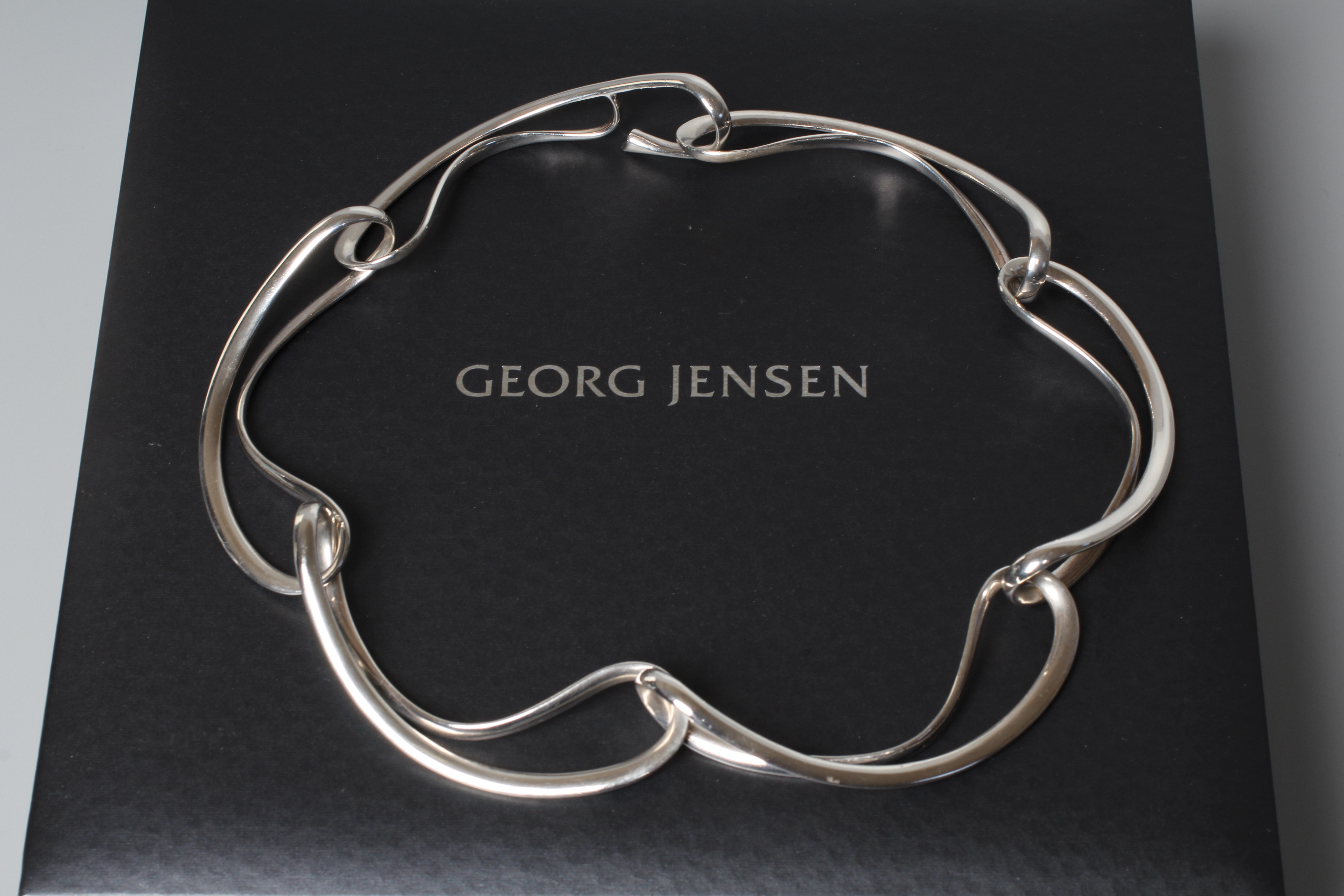 A GEORG JENSEN SILVER INFINITY CHOKER designed by Regitze Overgaard formed of six openwork Image