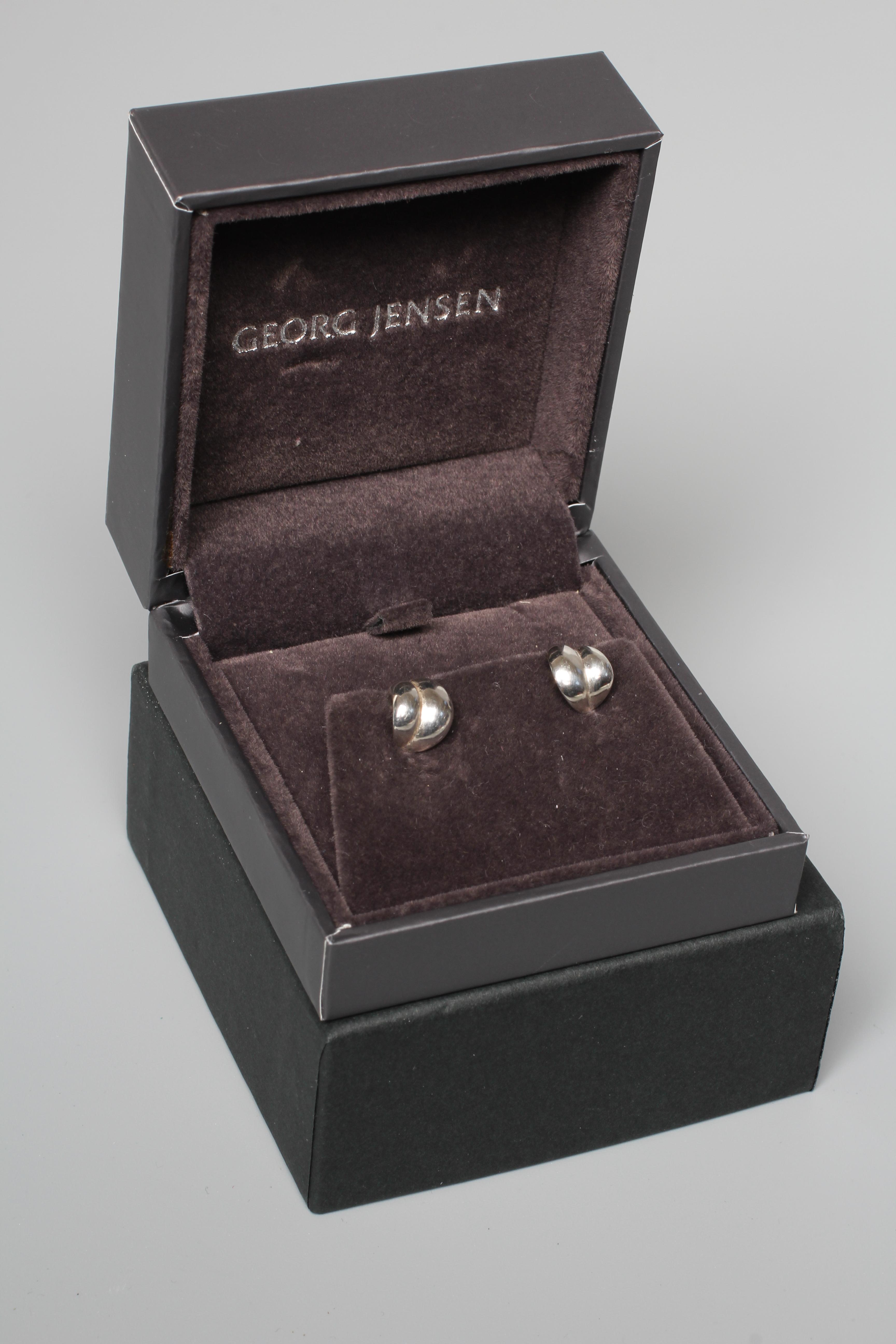 A PAIR OF GEORG JENSEN SILVER EAR STUDS of stylised leaf form, cased and boxed Image
