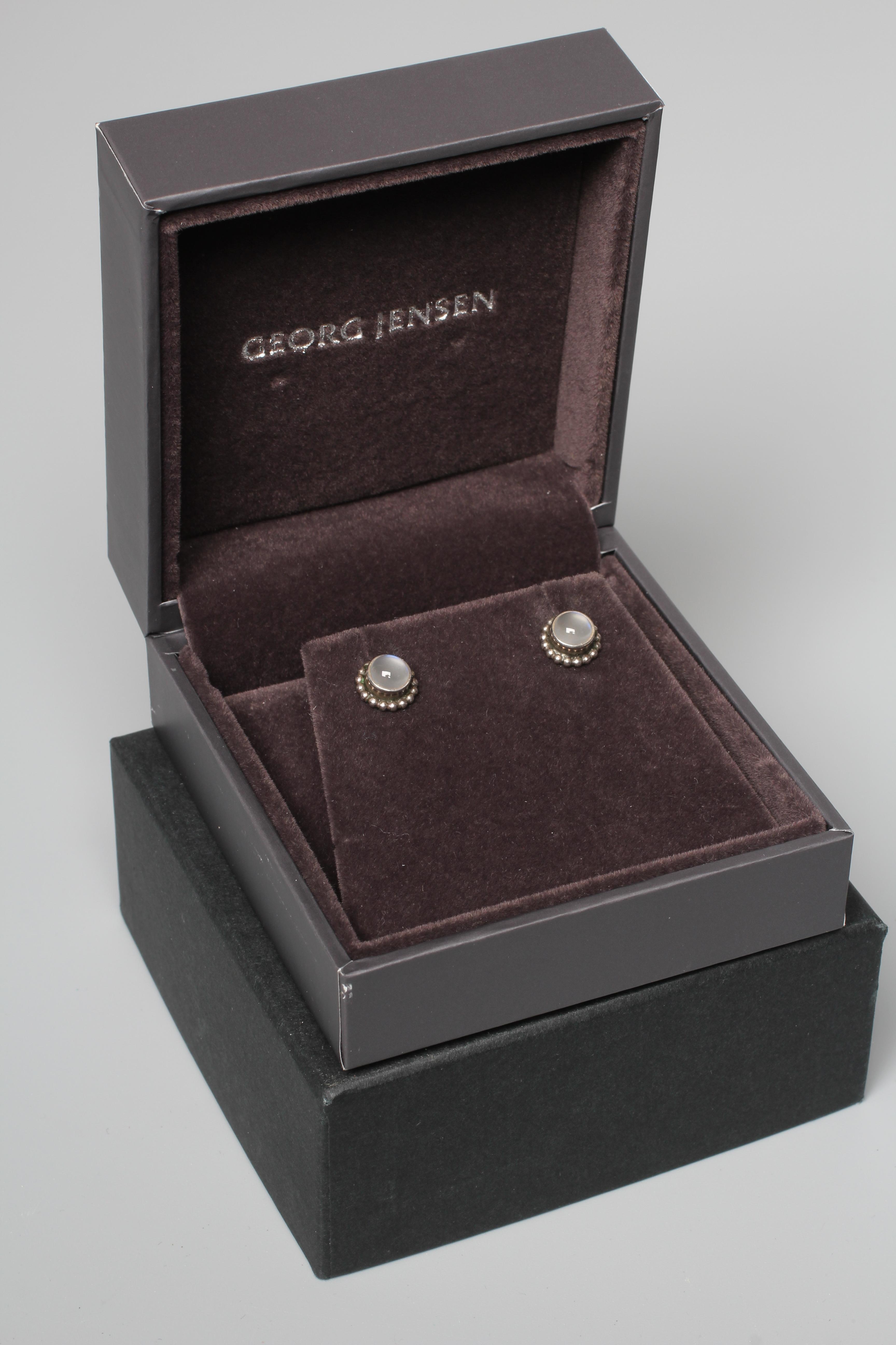 A PAIR OF GEORG JENSEN MOONLIGHT BLOSSOM SILVER EAR STUDS set with cabochon polished moonstones, Image