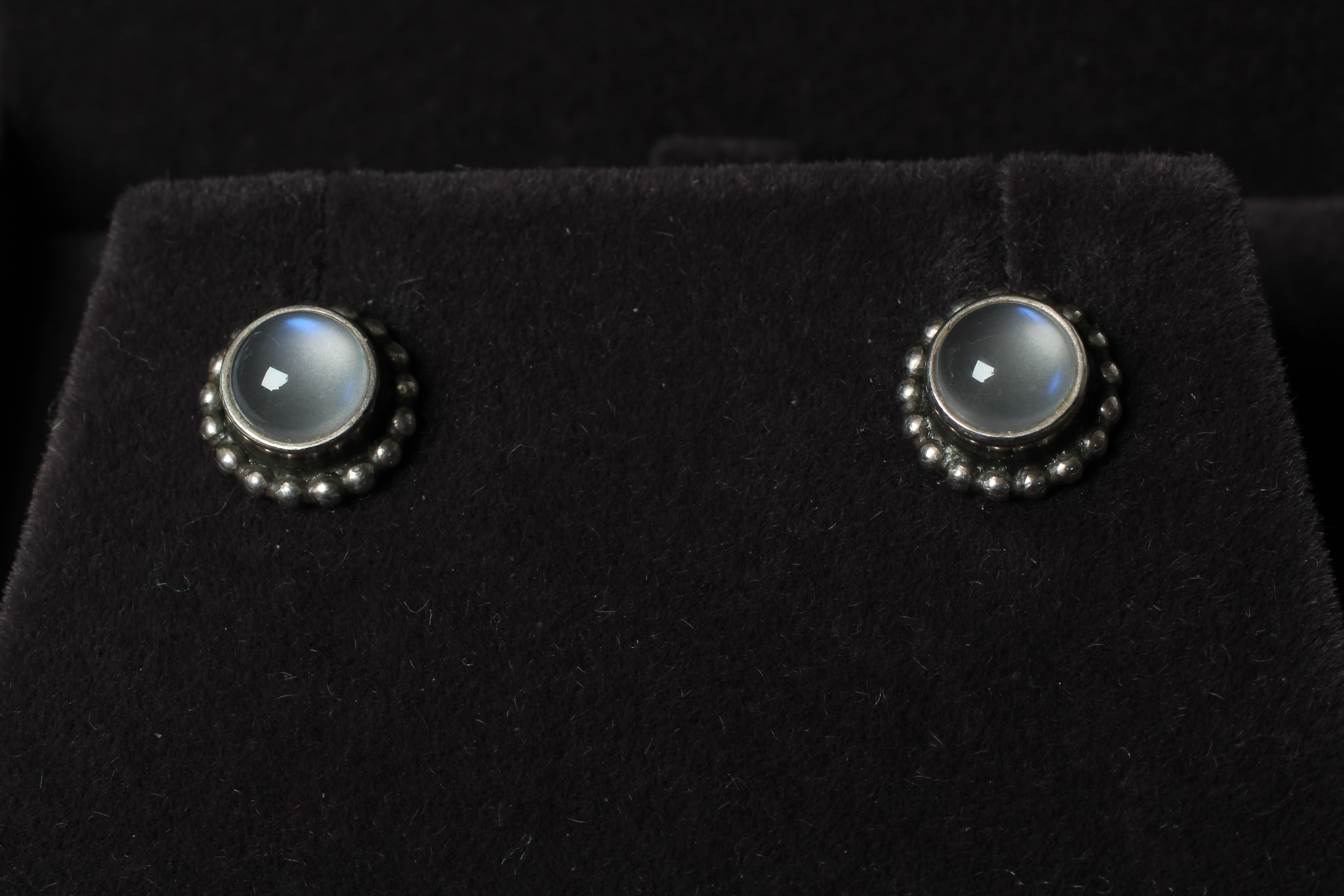 A PAIR OF GEORG JENSEN MOONLIGHT BLOSSOM SILVER EAR STUDS set with cabochon polished moonstones, Image