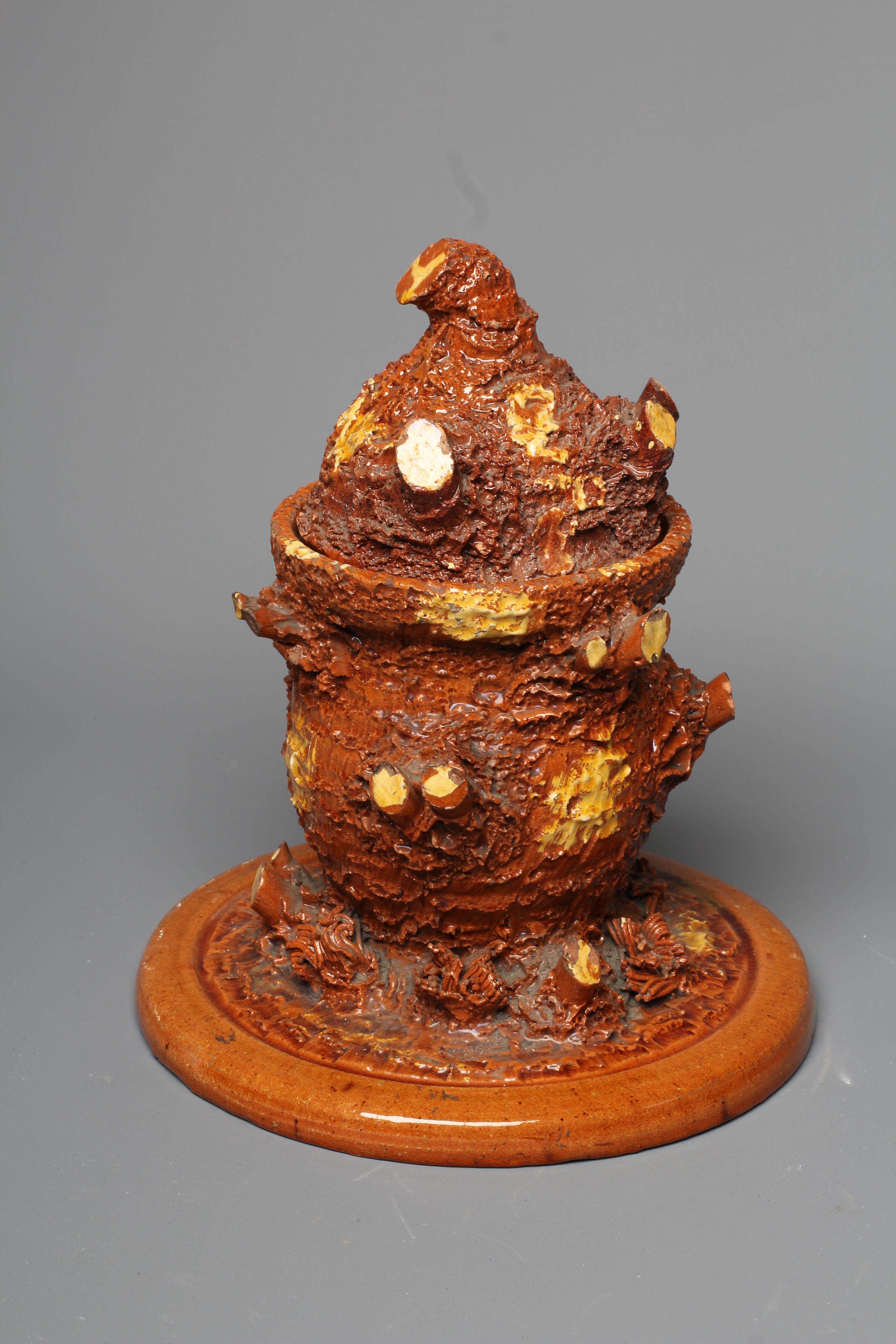 A LATE VICTORIAN SLIP GLAZED TERRACOTTA TOBACCO JAR AND COVER Image