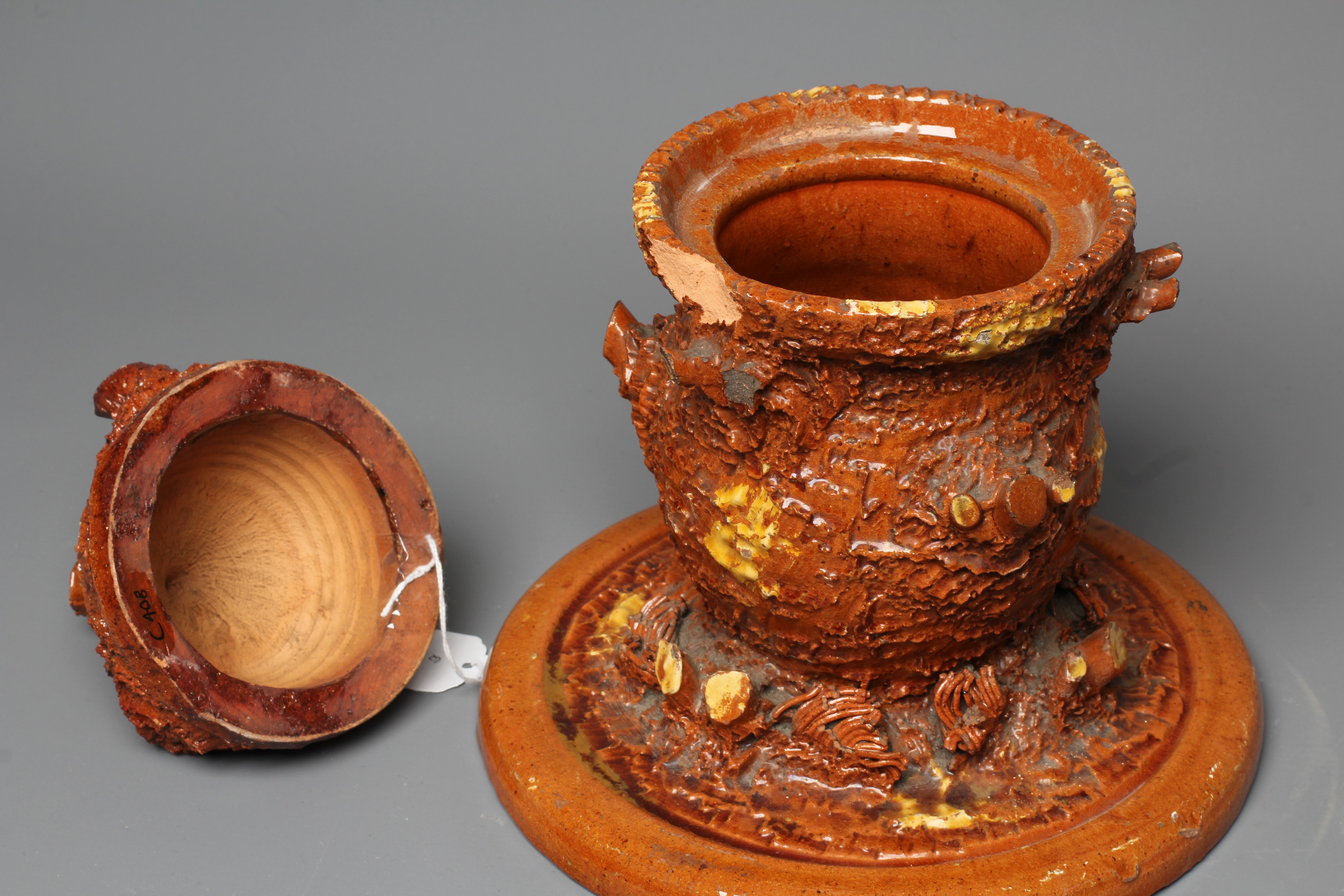 A LATE VICTORIAN SLIP GLAZED TERRACOTTA TOBACCO JAR AND COVER Image
