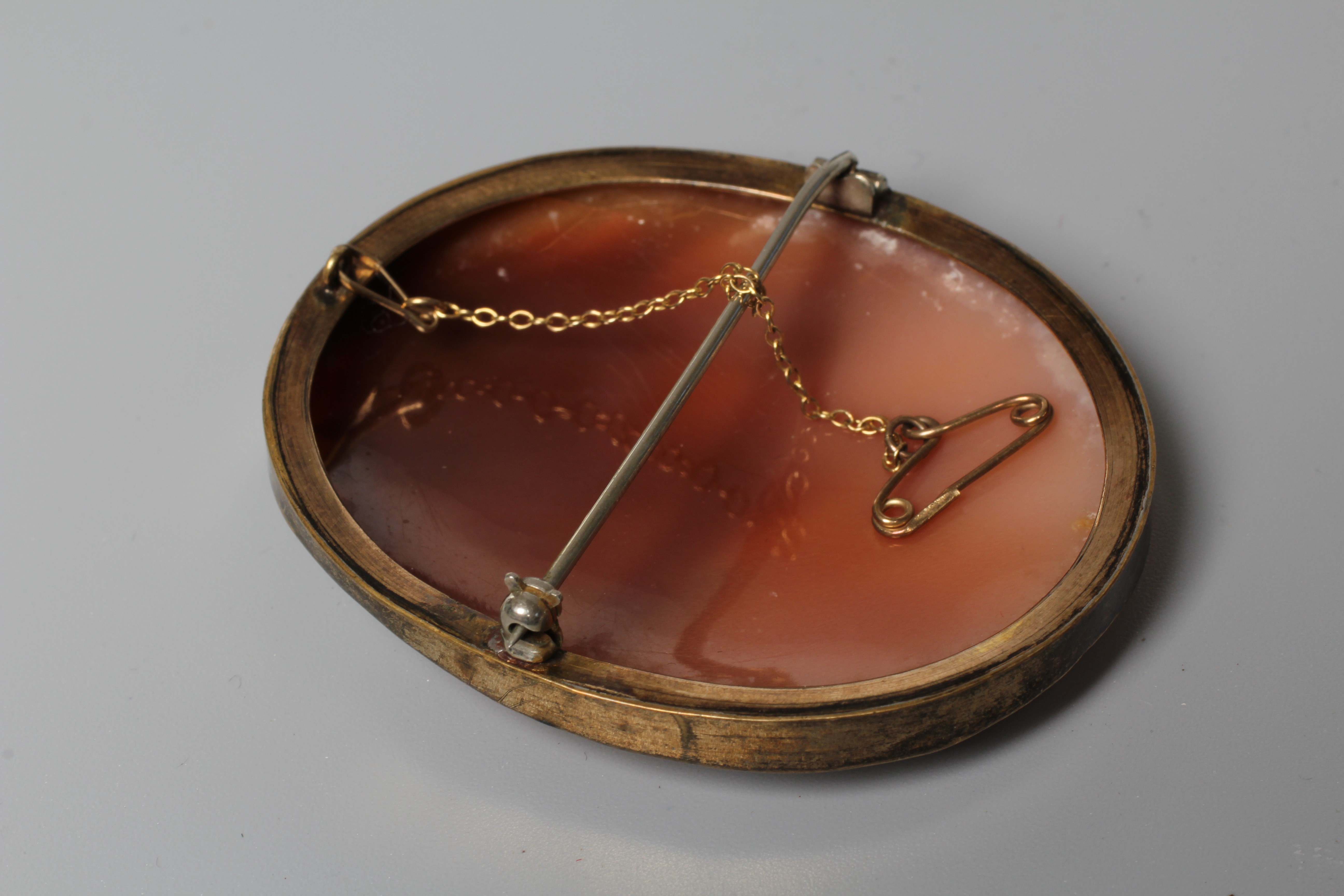 A VICTORIAN SHELL CAMEO BROOCH carved as Dionysus, in a plain gold plated mount Image