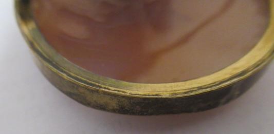A VICTORIAN SHELL CAMEO BROOCH carved as Dionysus, in a plain gold plated mount Image