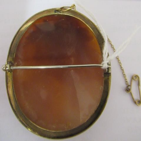 A VICTORIAN SHELL CAMEO BROOCH carved as Dionysus, in a plain gold plated mount Image