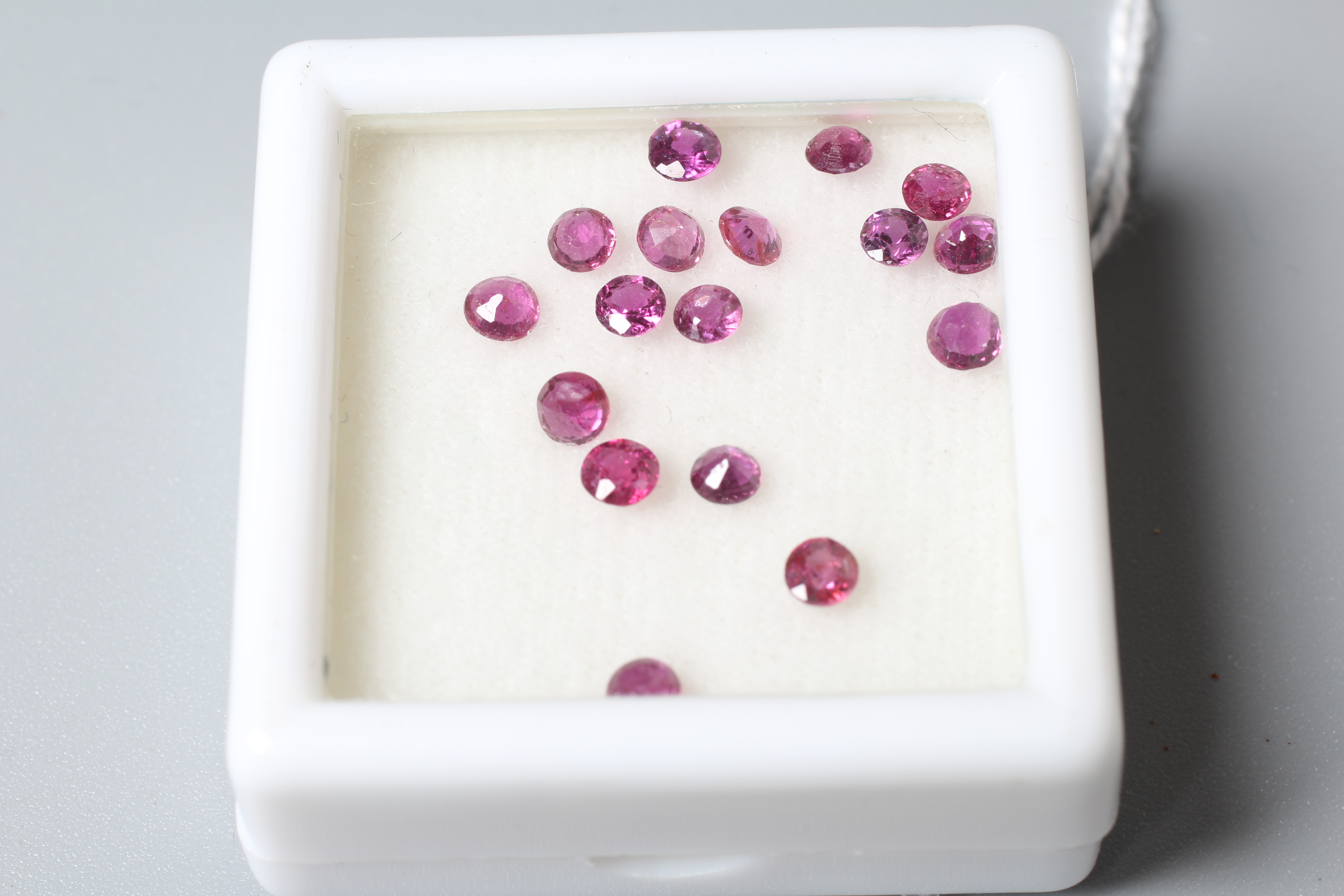 SEVENTEEN ROUND CUT UNMOUNTED RUBIES totalling 3.25cts Image
