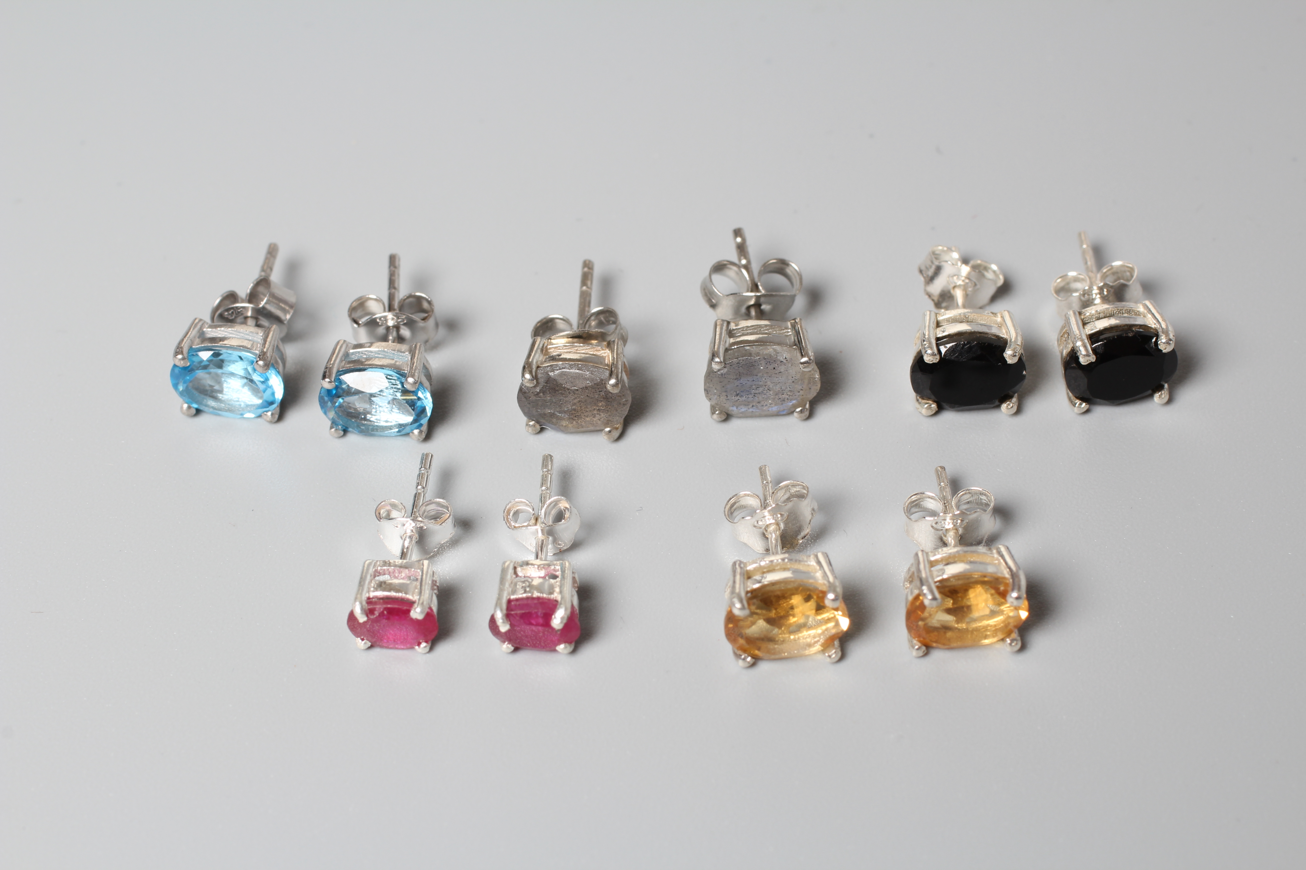 FIVE PAIRS OF SILVER EAR STUDS including citrines, onyx and blue topaz Image