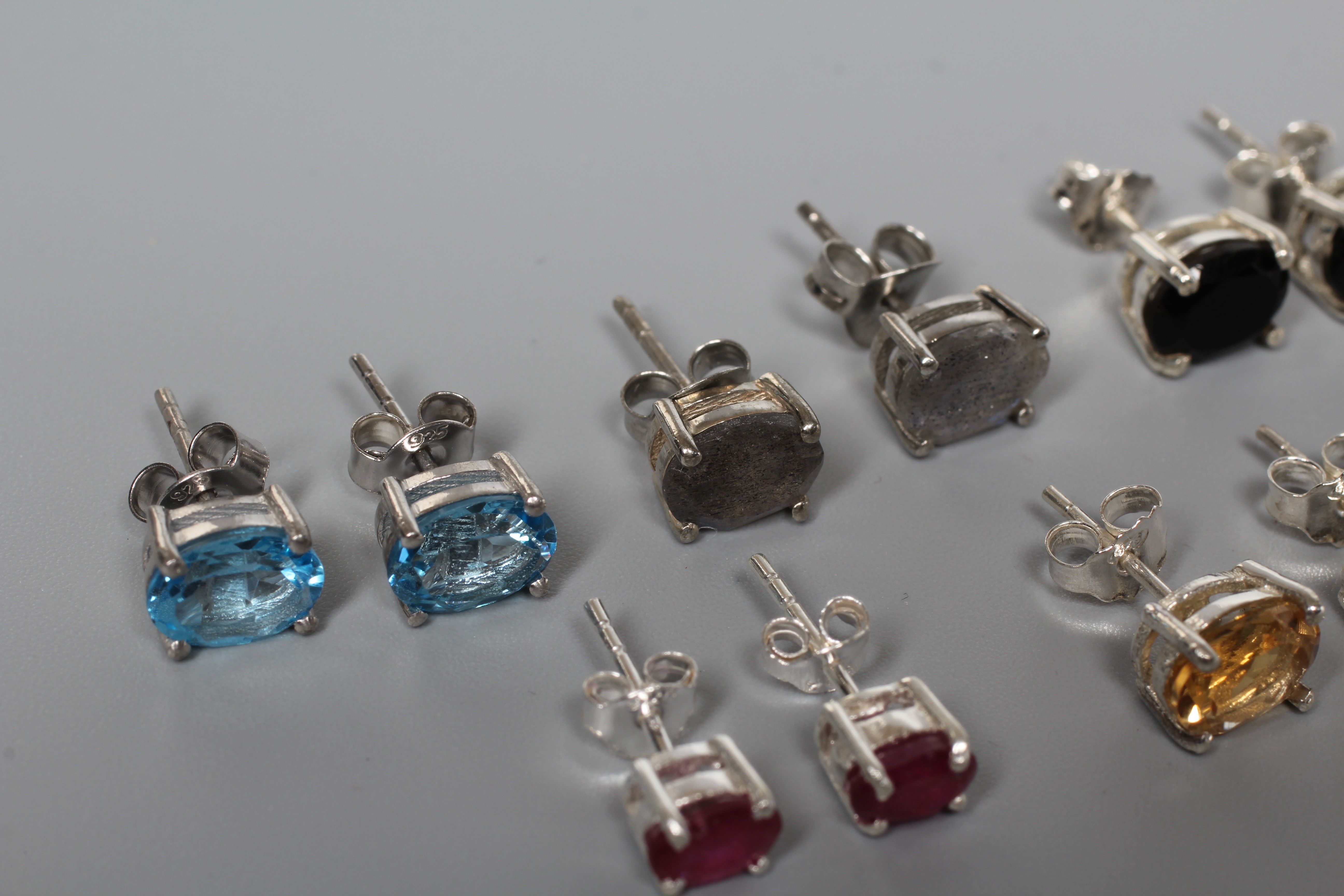 FIVE PAIRS OF SILVER EAR STUDS including citrines, onyx and blue topaz Image