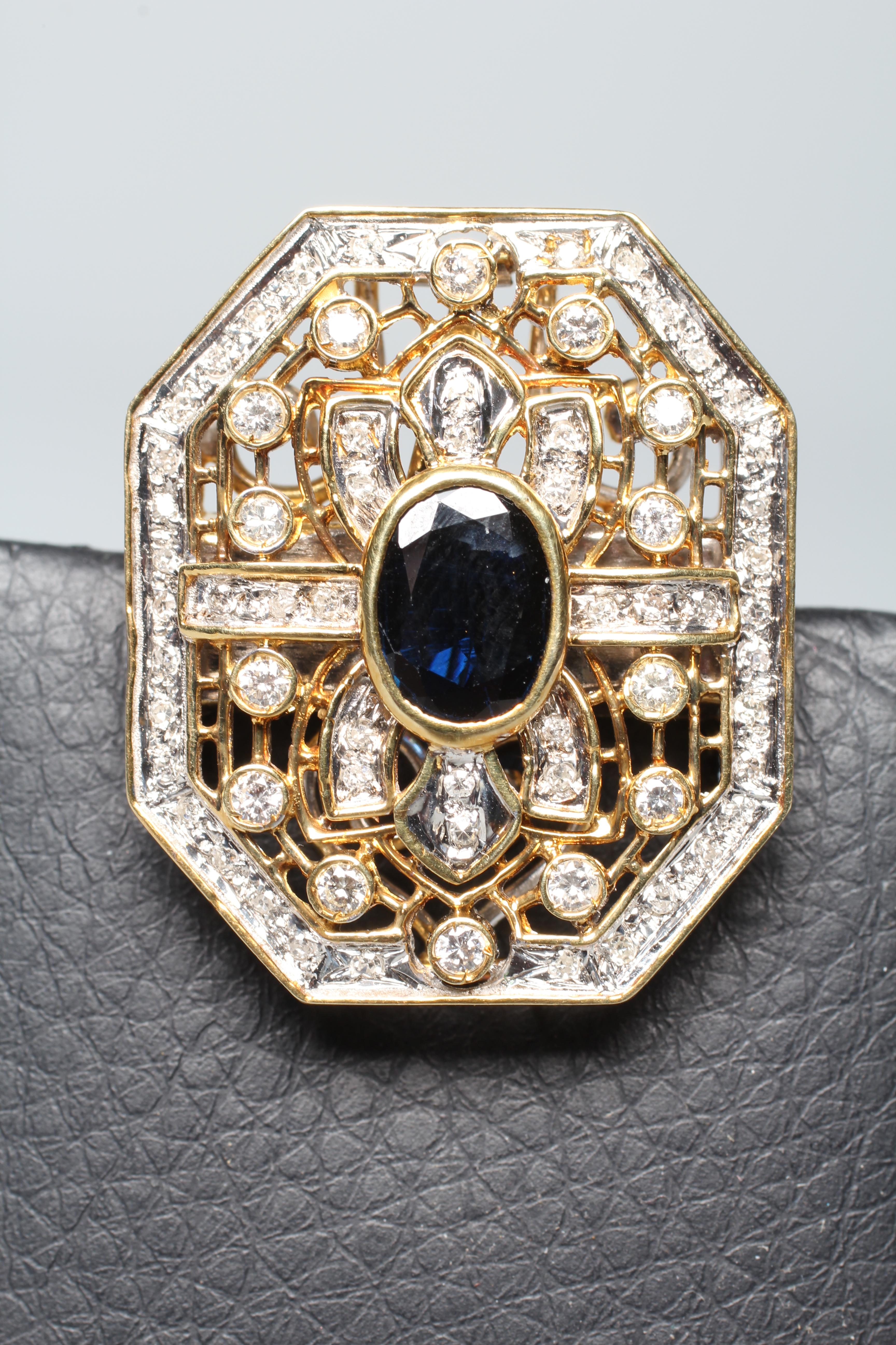 AN ART DECO STYLE SAPPHIRE AND DIAMOND PENDANT/BROOCH of canted oblong form Image