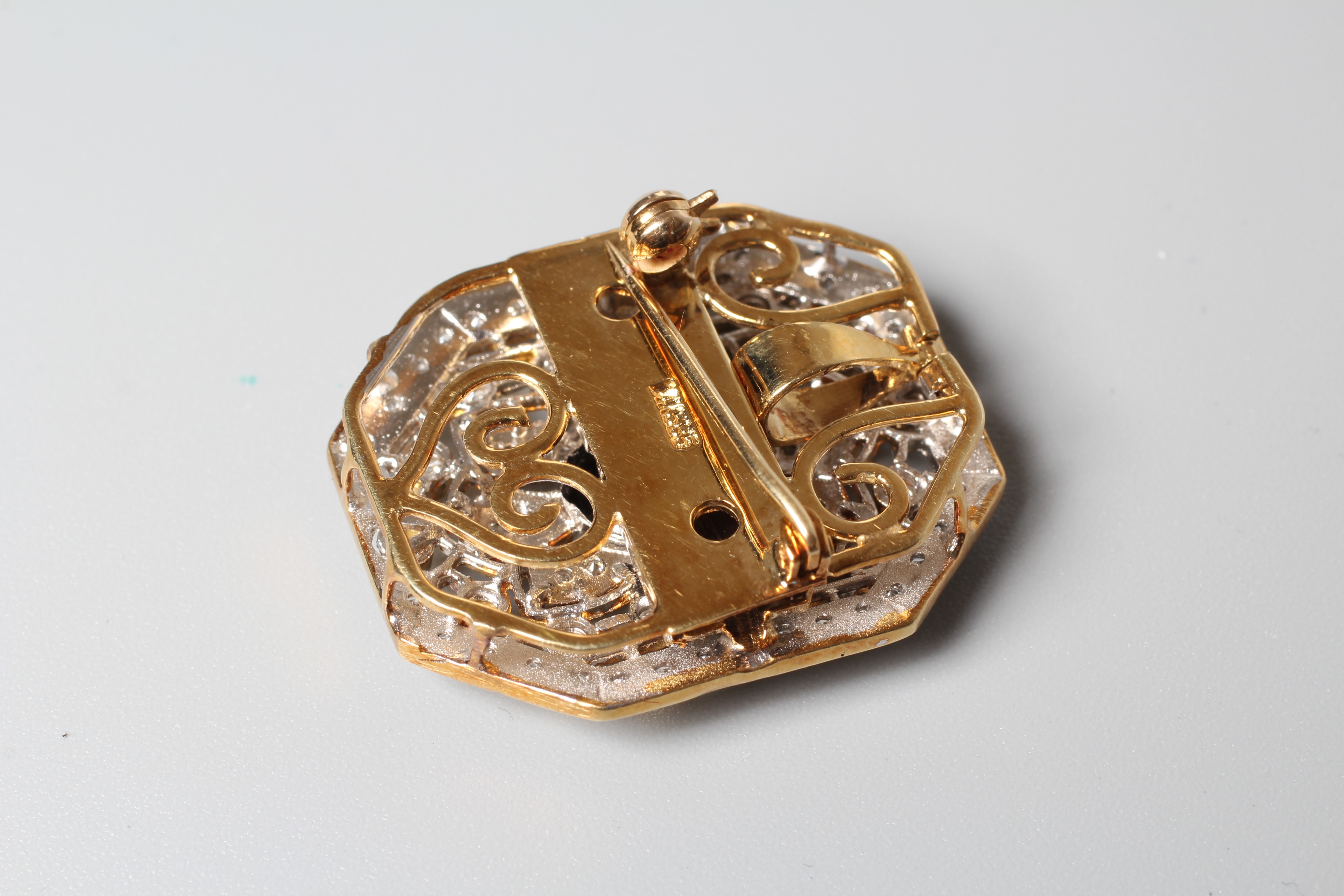 AN ART DECO STYLE SAPPHIRE AND DIAMOND PENDANT/BROOCH of canted oblong form Image